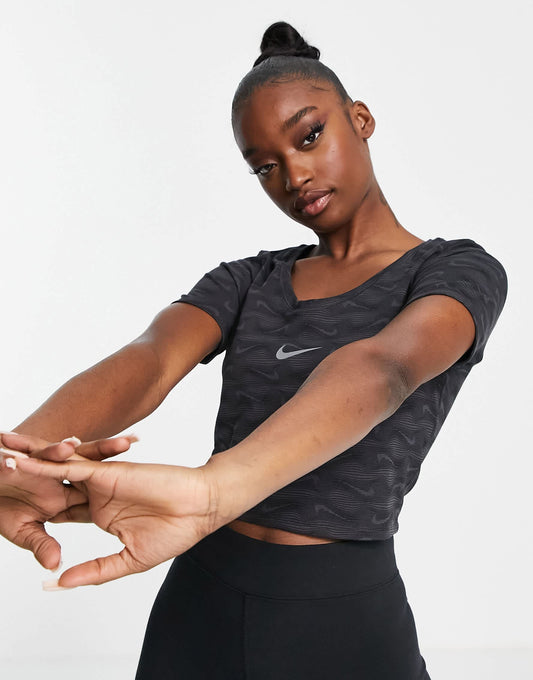 Nike all over printed logo cropped t-shirt with scoop neck in black