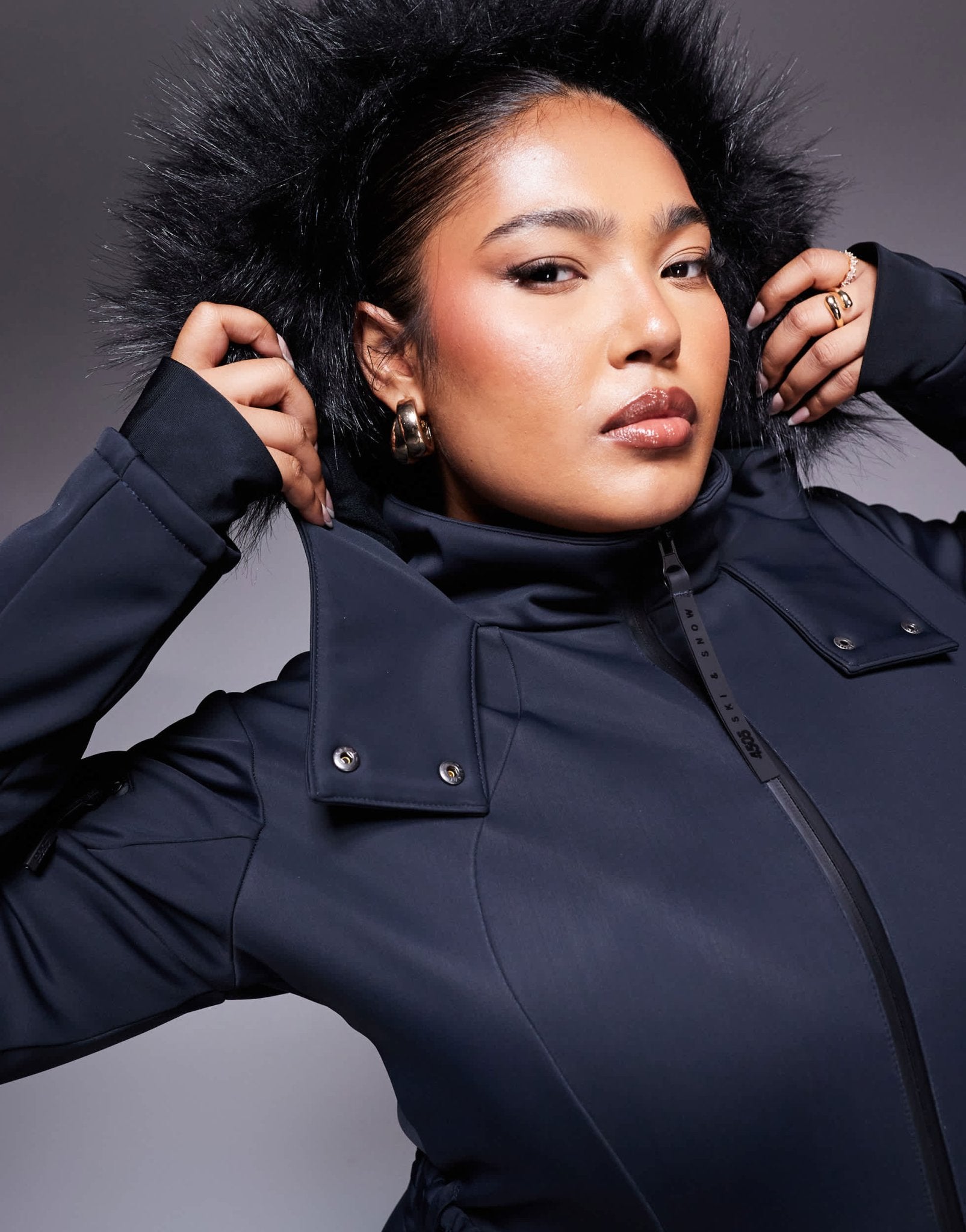 4505 Curve Icon belted ski suit with slim kick leg and faux fur hood in black - ASOS Sample Sale