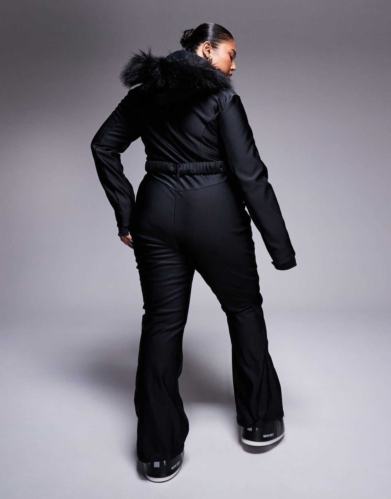 4505 Curve Ski belted ski suit with slim kick leg and faux fur hood in black gloss - ASOS Sample Sale