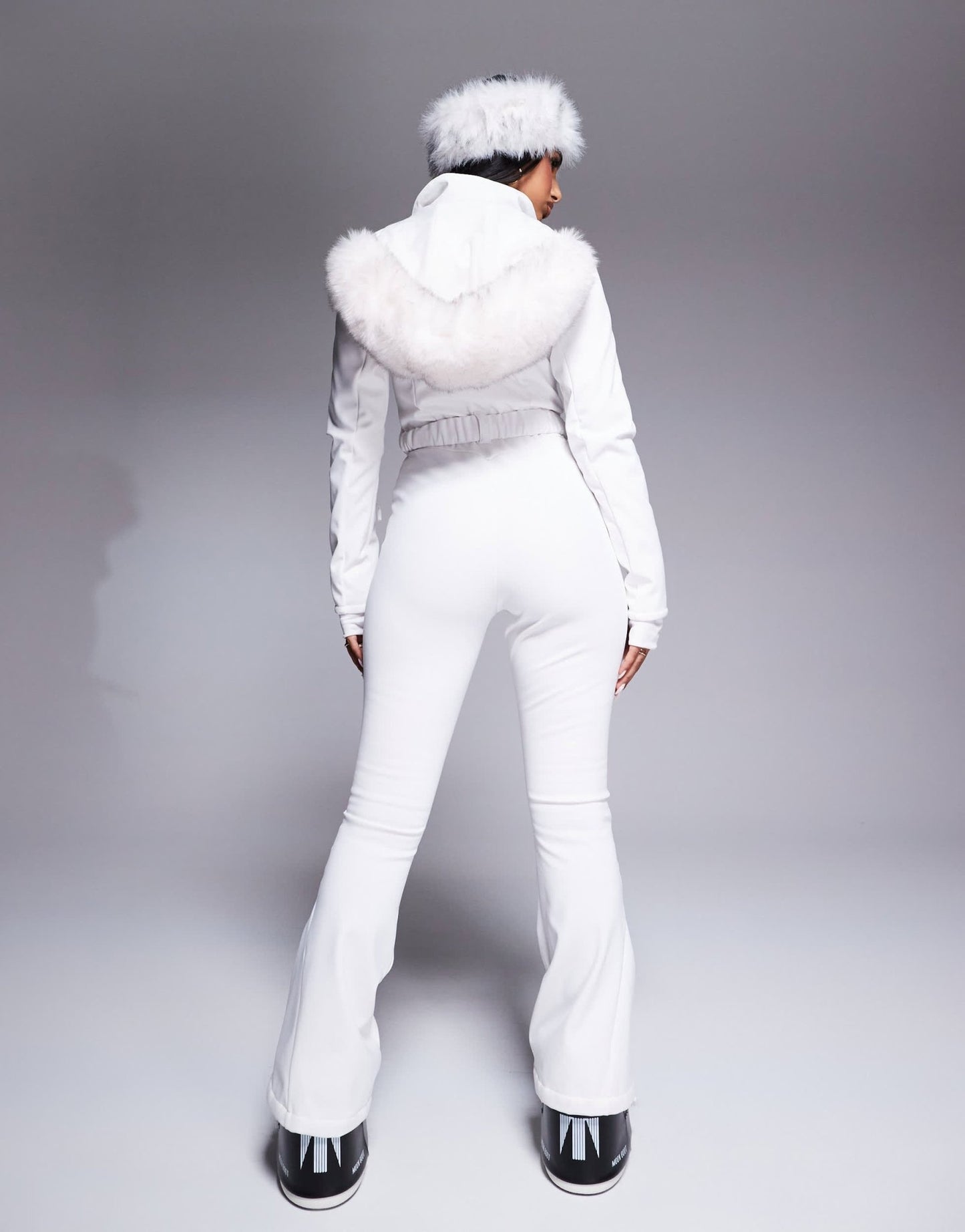 4505 Ski belted ski suit with slim kick leg and faux fur hood in white - ASOS Sample Sale