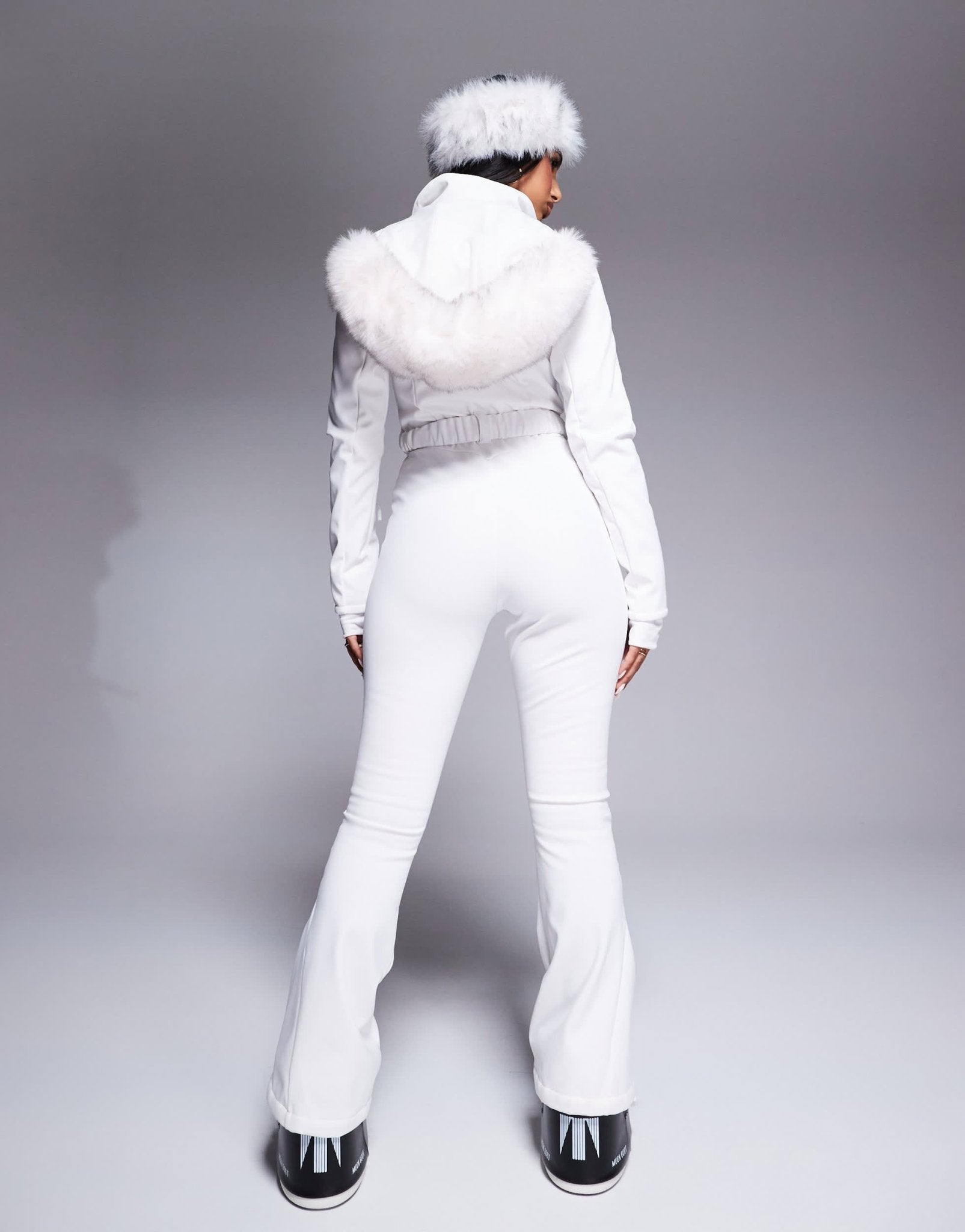 4505 Ski belted ski suit with slim kick leg and faux fur hood in white - ASOS Sample Sale