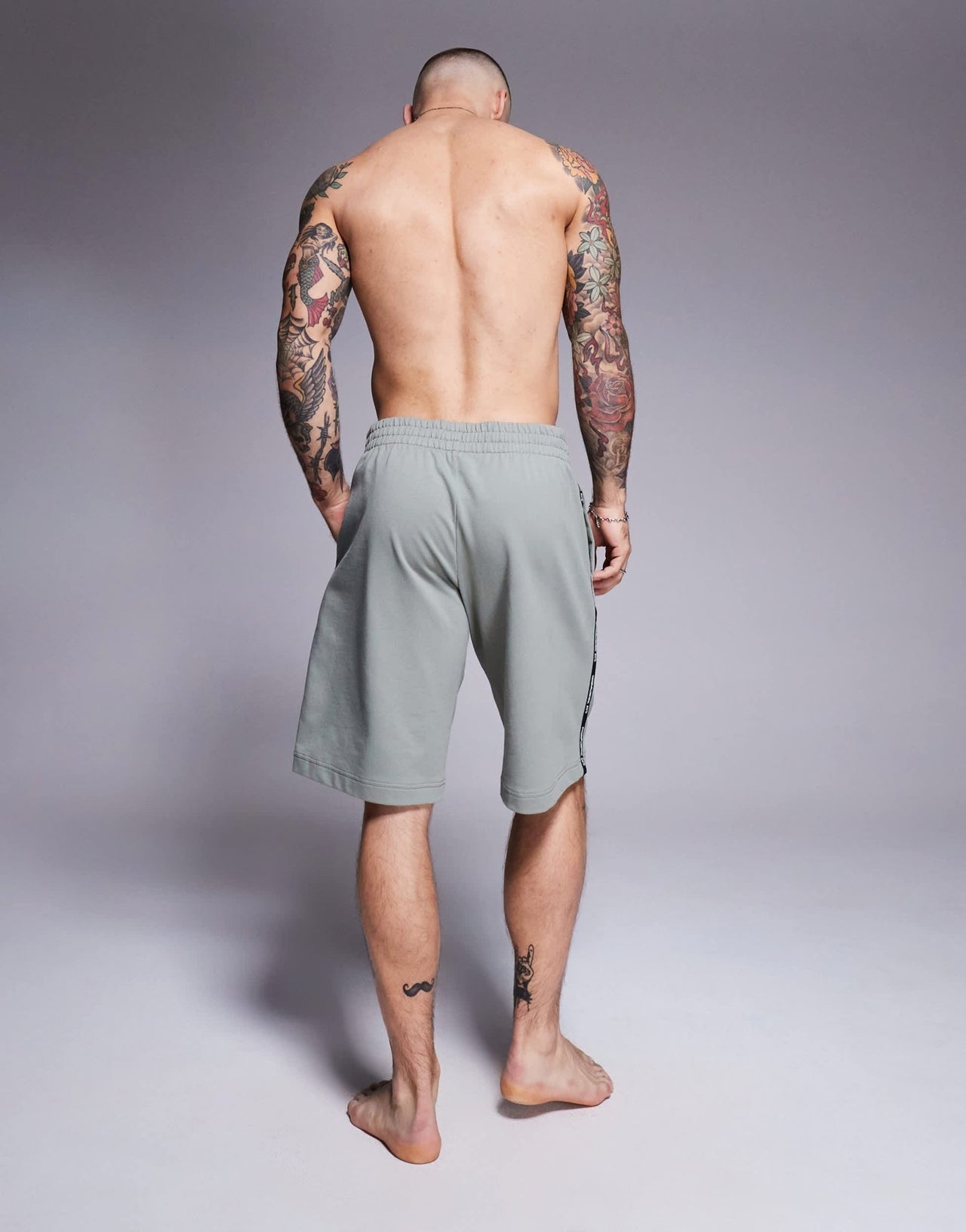Armani EA7 cuffed sweat shorts with logo tape detail in sage green - ASOS Sample Sale