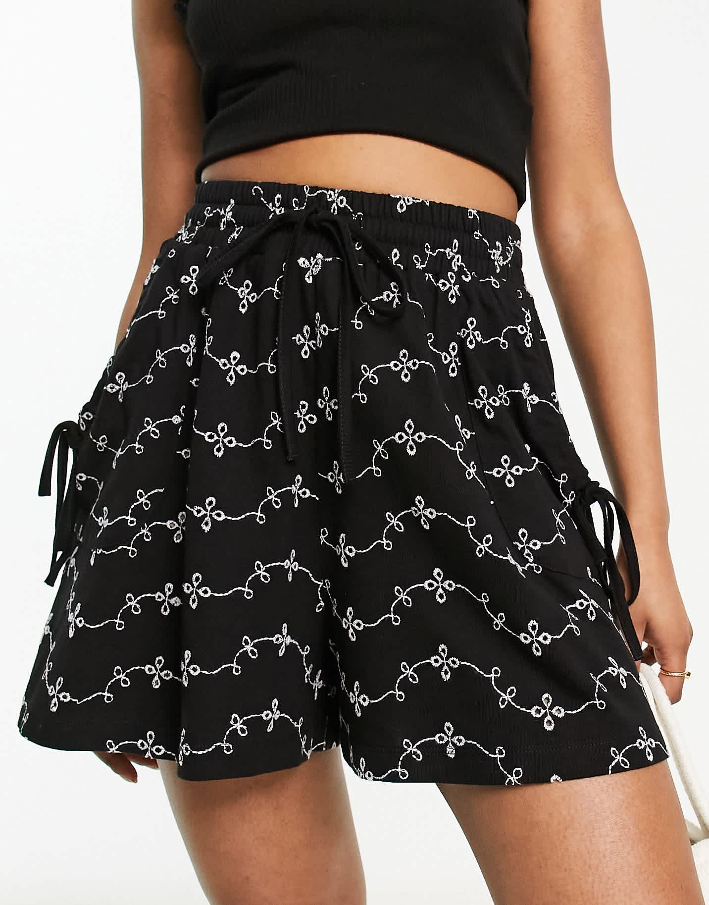 ASOS DESIGN broderie shorts with tie pockets in black/white - ASOS Sample Sale