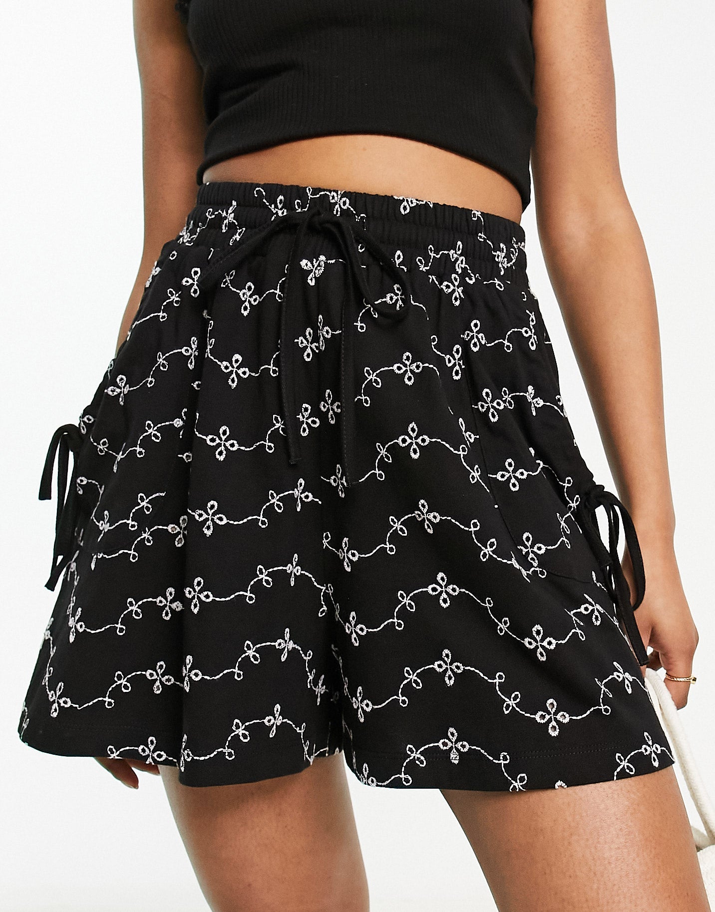ASOS DESIGN broderie shorts with tie pockets in black/white - ASOS Sample Sale