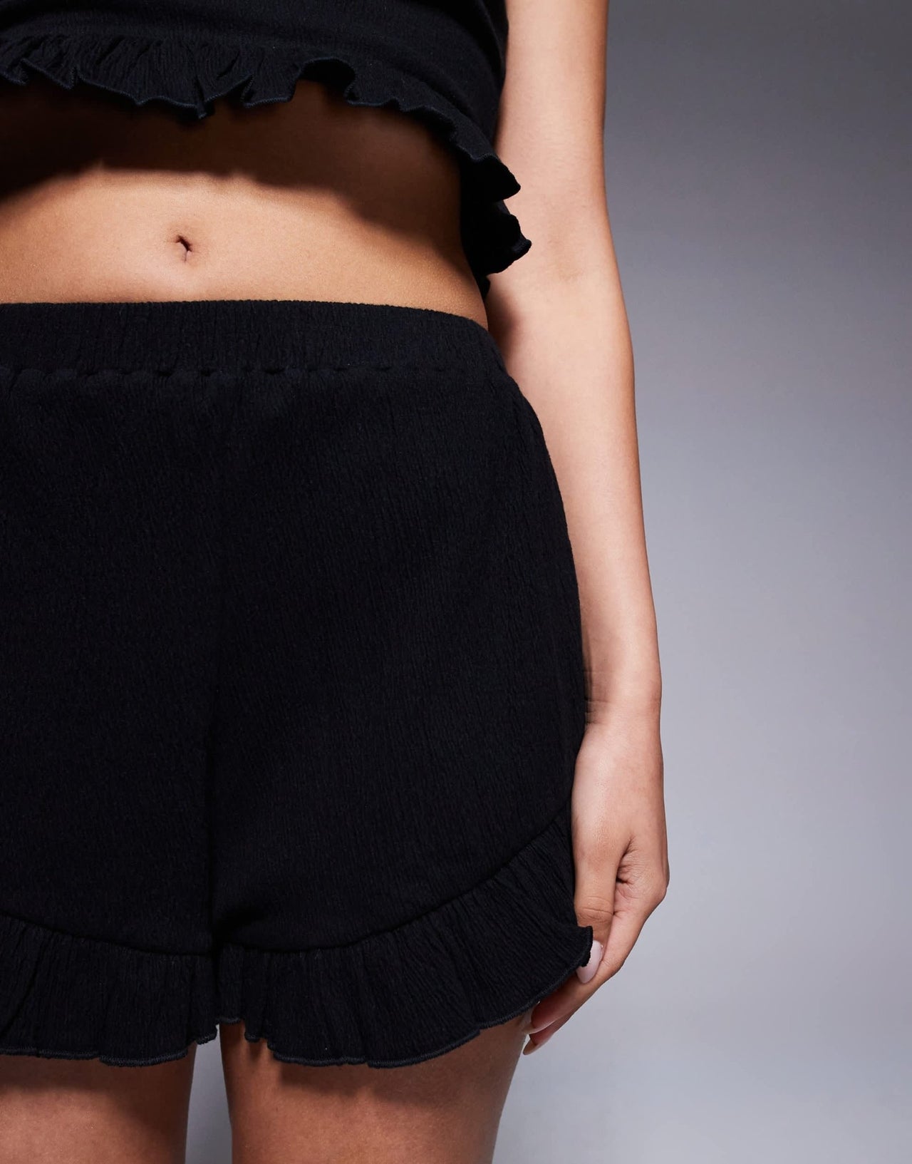 ASOS DESIGN co-ord crinkle flippy shorts with frill hem in black - ASOS Sample Sale