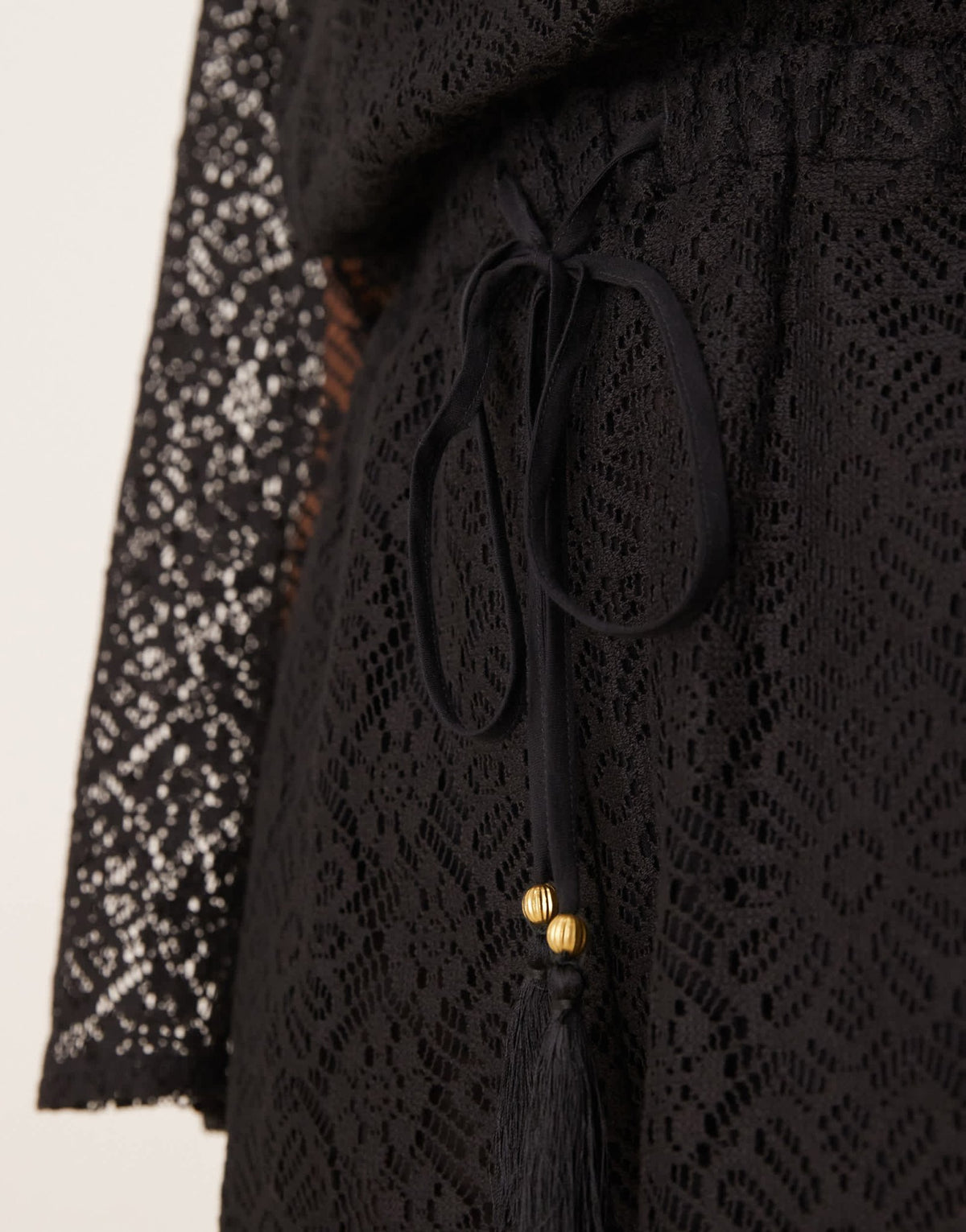 ASOS DESIGN crochet long sleeve mini playsuit with drawstring in black - ASOS Sample Sale