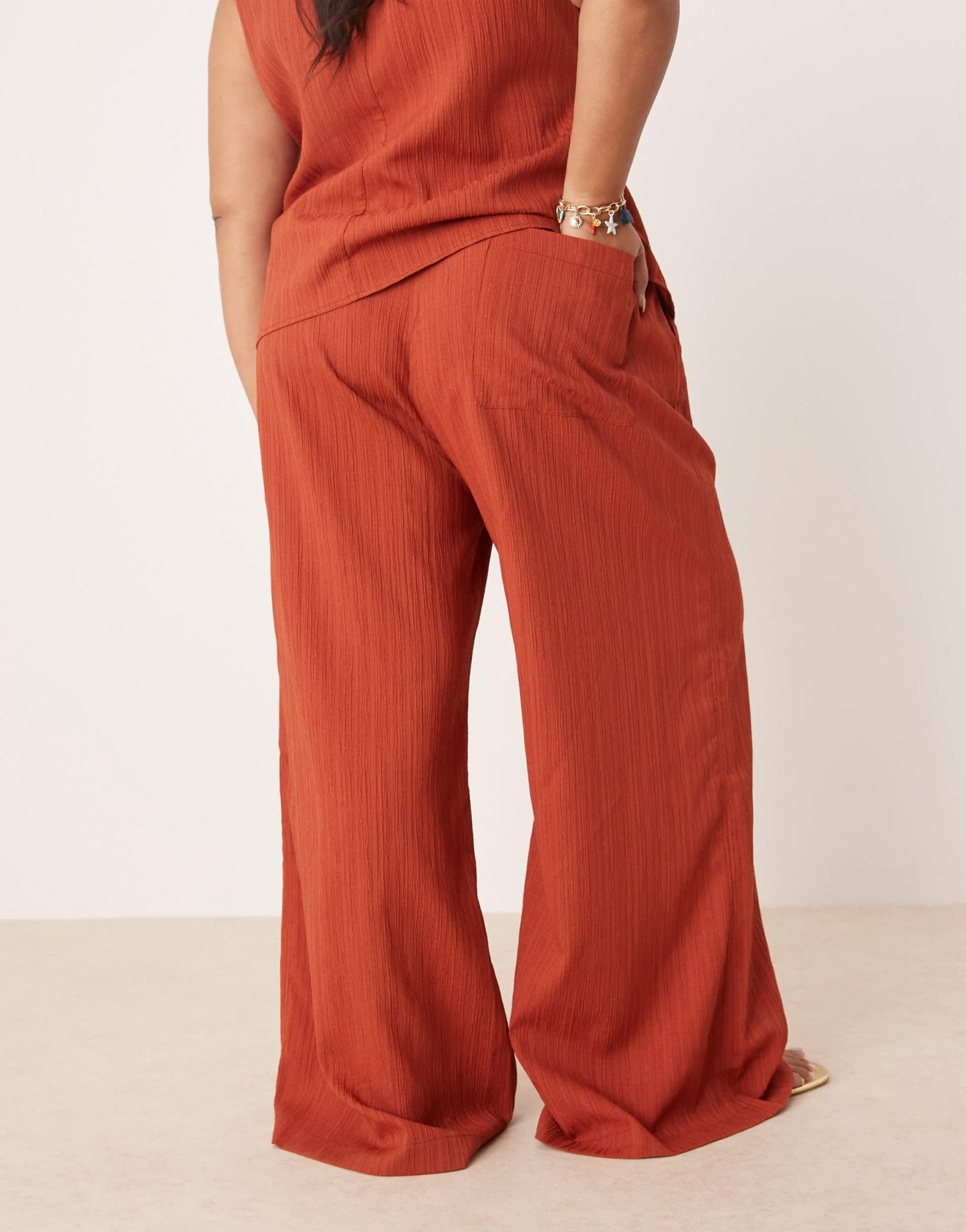 ASOS DESIGN Curve crinkle palazzo trousers co-ord in rust - ASOS Sample Sale
