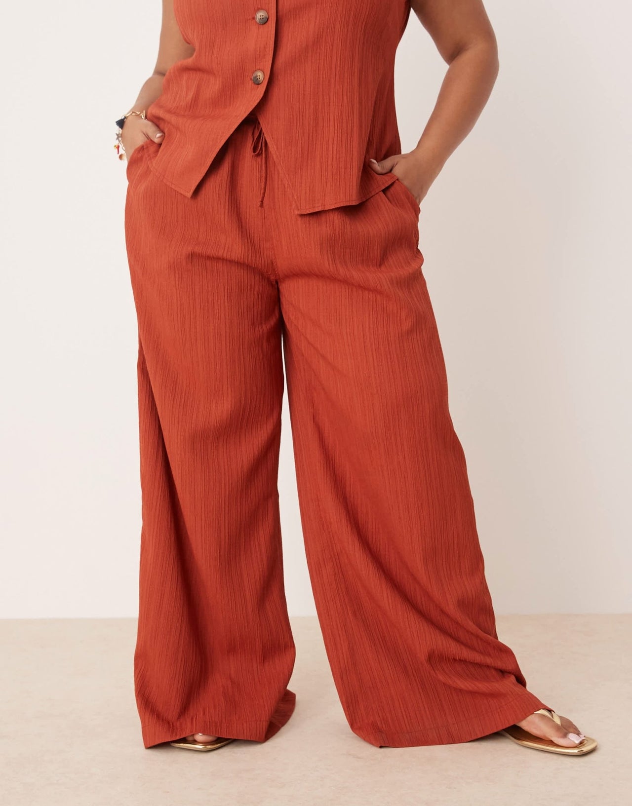 ASOS DESIGN Curve crinkle palazzo trousers co-ord in rust - ASOS Sample Sale
