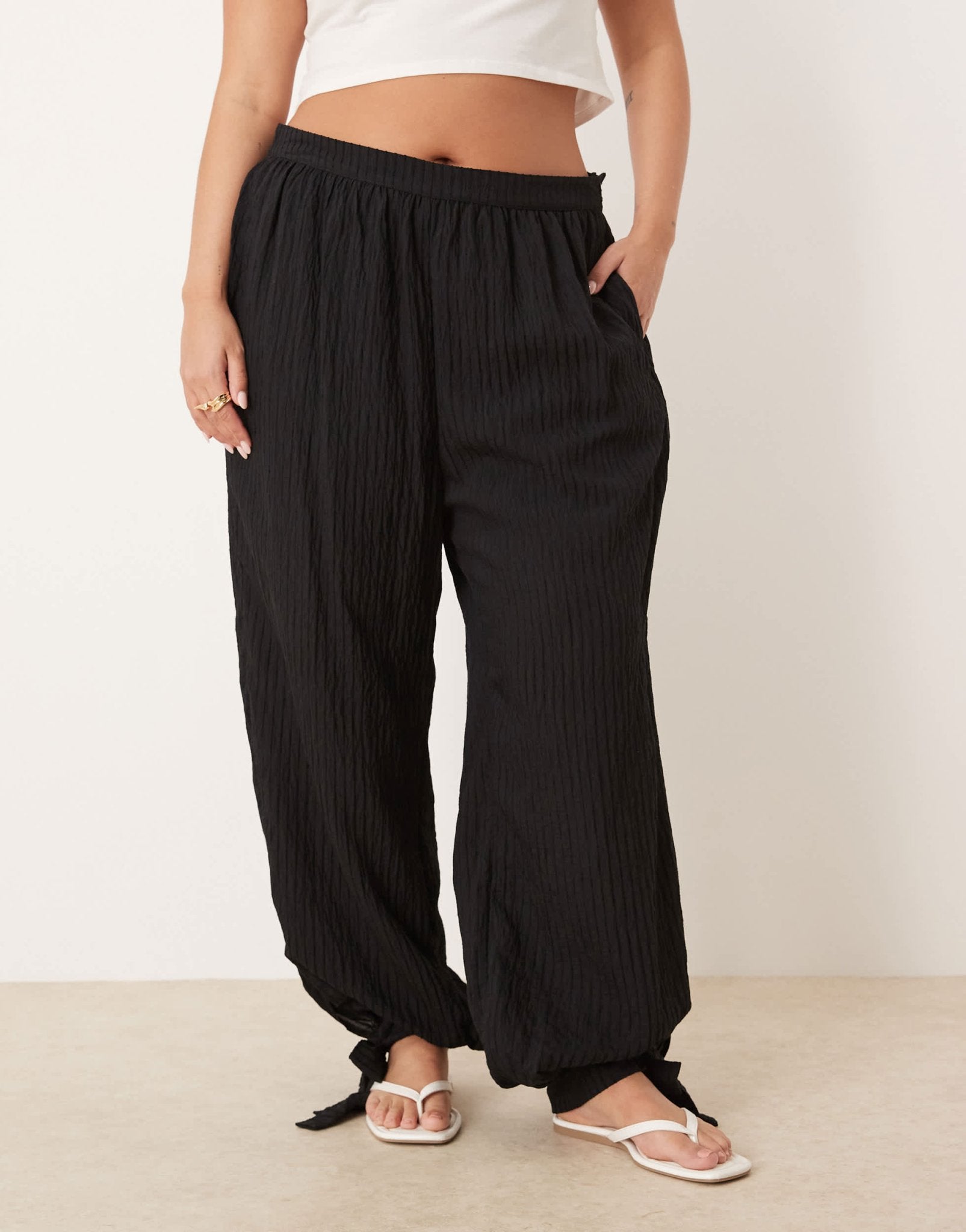 ASOS DESIGN Curve textured stripe billow trousers with cuff detail in black - ASOS Sample Sale