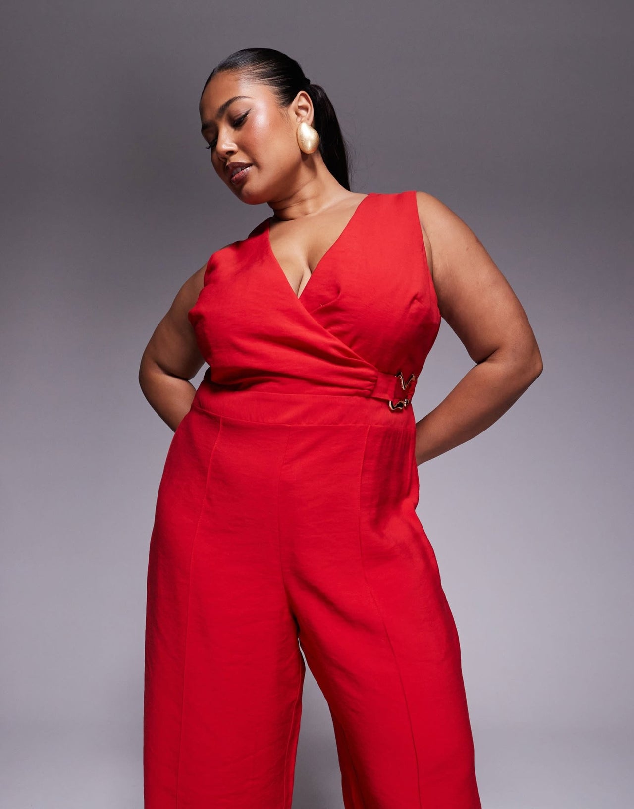 ASOS DESIGN Curve wrap front cut out jumpsuit with buckle detail in red - ASOS Sample Sale
