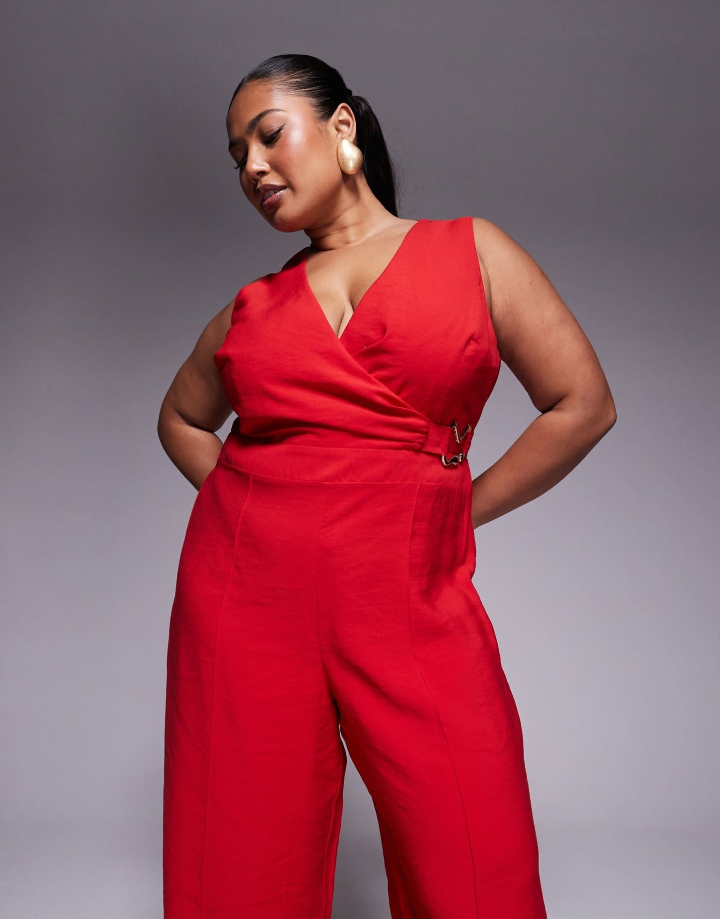 ASOS DESIGN Curve wrap front cut out jumpsuit with buckle detail in red - ASOS Sample Sale