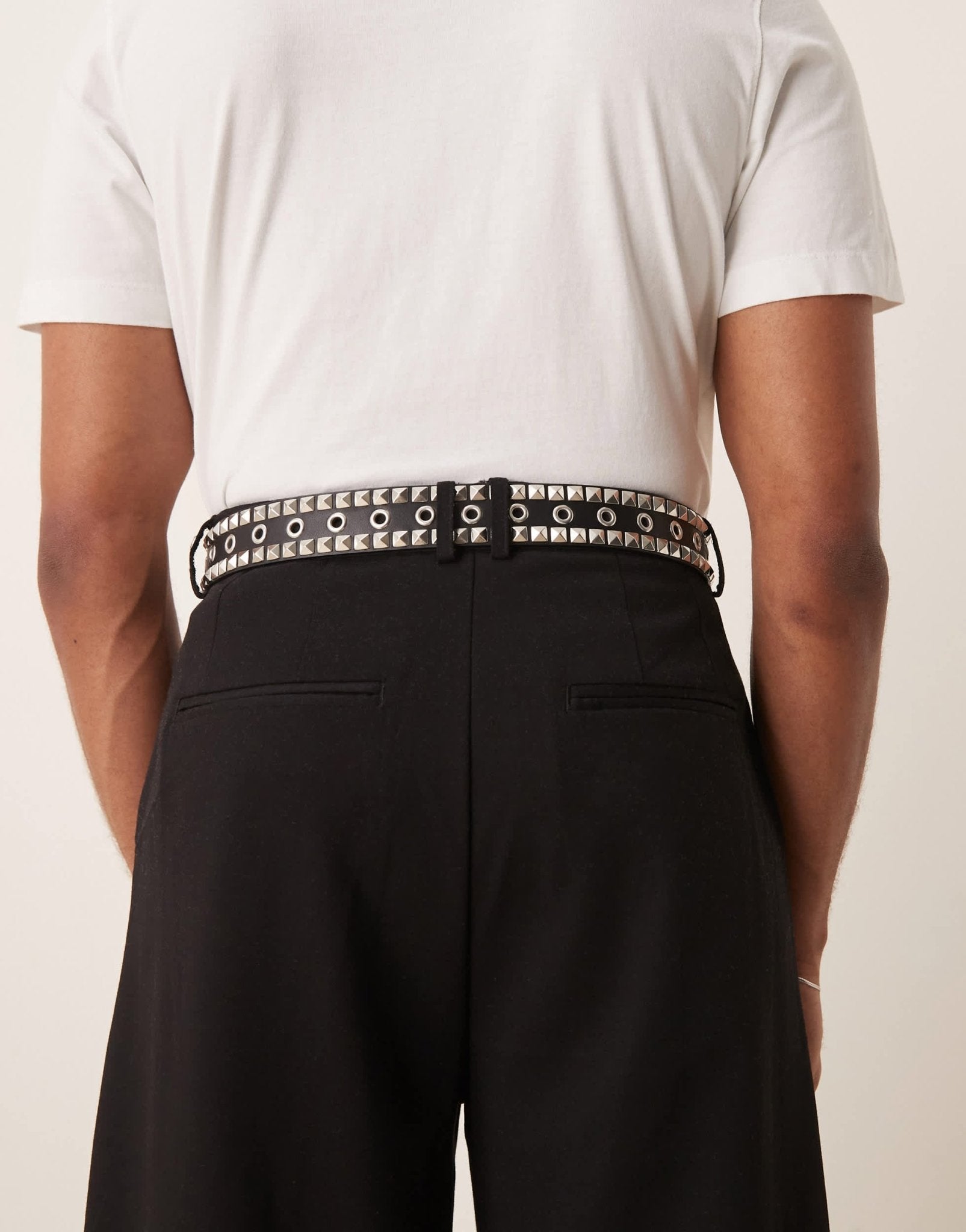 ASOS DESIGN eyelet belt with studding in black faux leather - ASOS Sample Sale