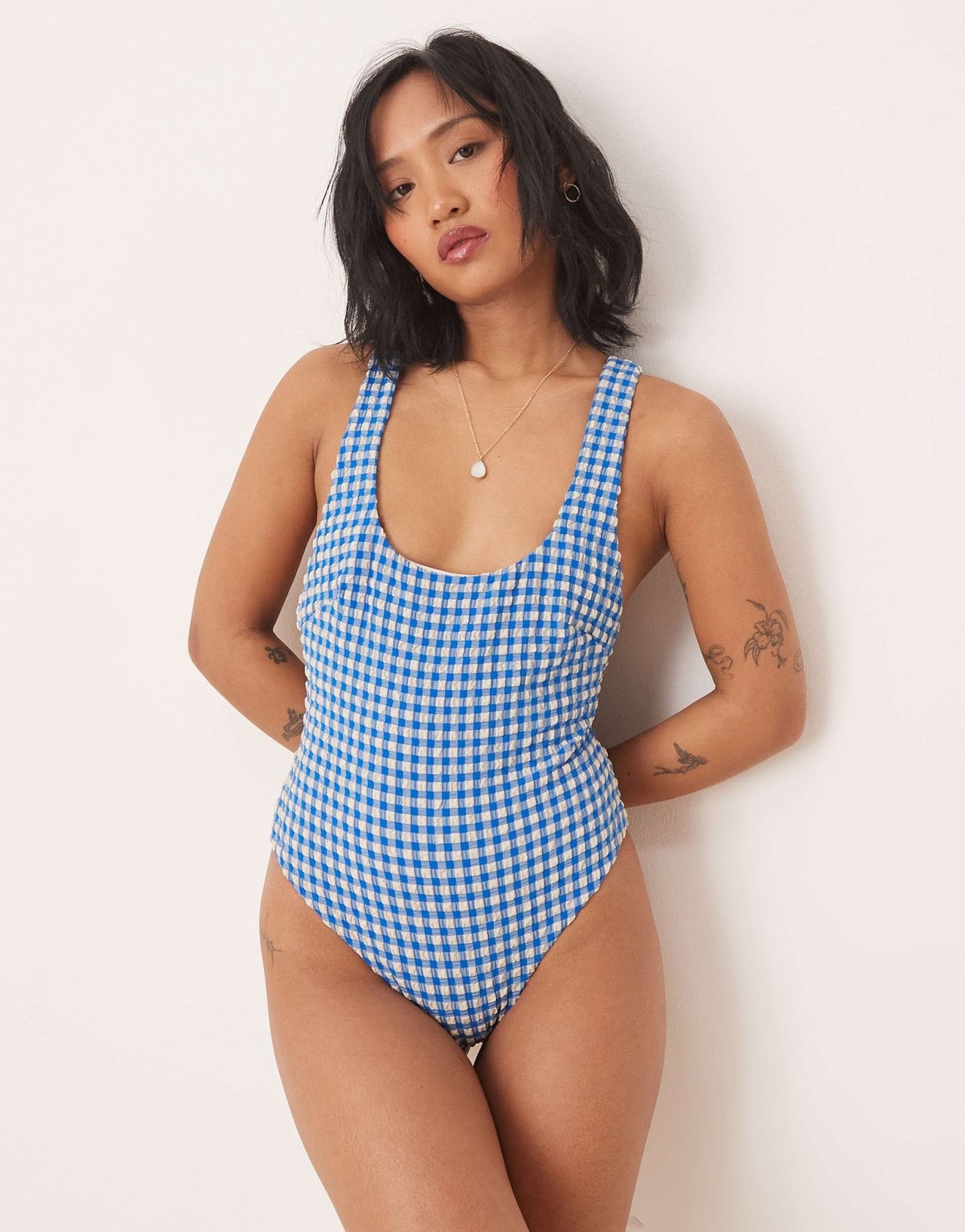 ASOS DESIGN Petite seersucker scoop swimsuit with giant bow back detail in blue gingham - ASOS Sample Sale