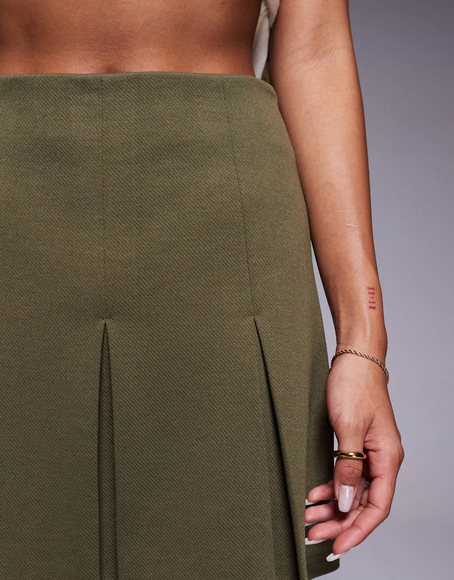 ASOS DESIGN pleated jersey twill mini skirt in Khaki - ASOS Sample Sale