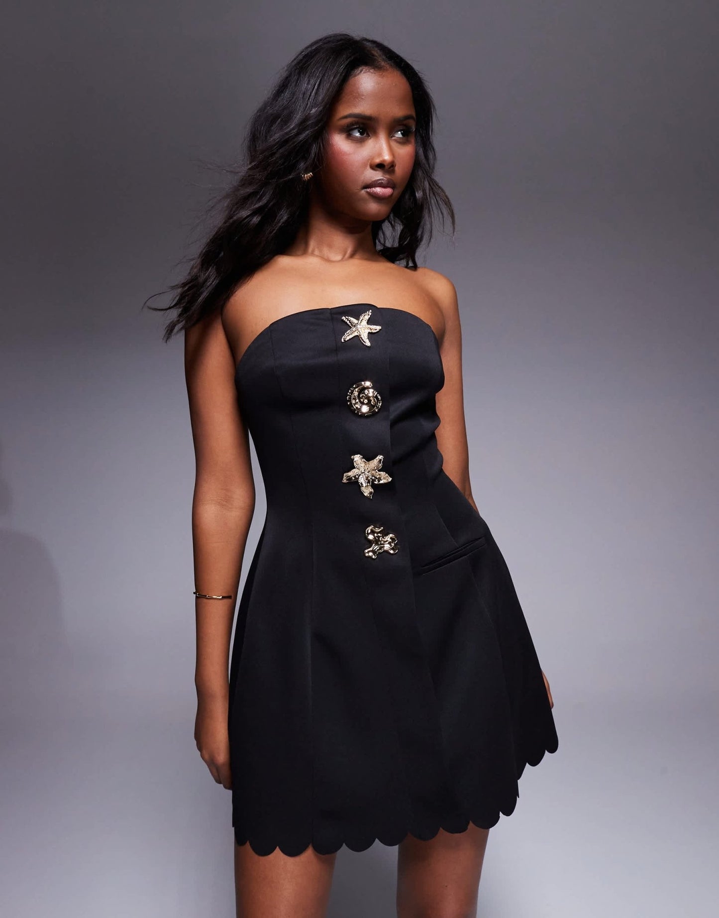 ASOS DESIGN scallop edge bandeau mini dress with gold shell buttons in black in scuba - style fabric - ASOS Sample Sale
