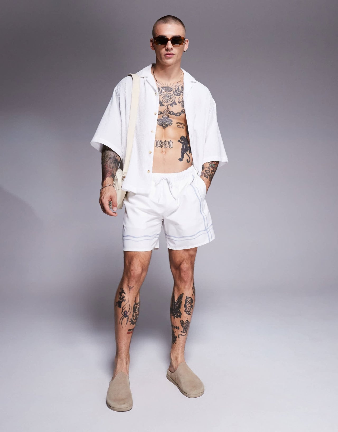 ASOS DESIGN swim shorts in mid length in stone with border print - ASOS Sample Sale