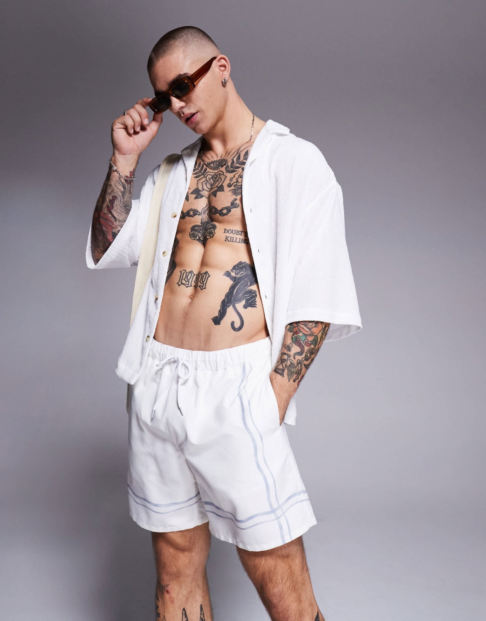 ASOS DESIGN swim shorts in mid length in stone with border print - ASOS Sample Sale