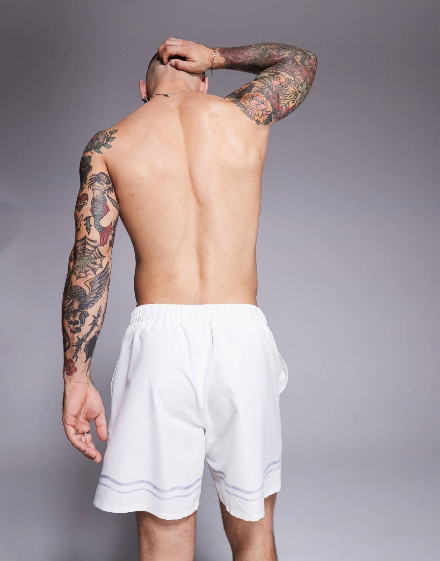 ASOS DESIGN swim shorts in mid length in stone with border print - ASOS Sample Sale