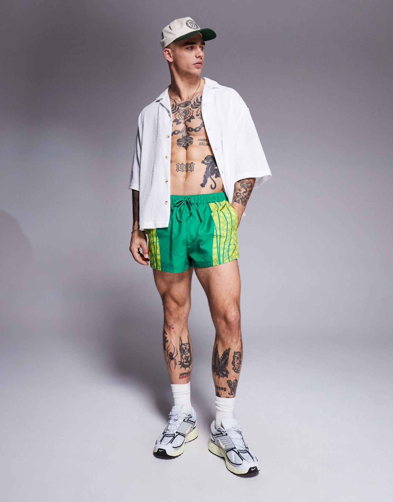 ASOS DESIGN swim shorts in super short length with placement animal print in green - ASOS Sample Sale