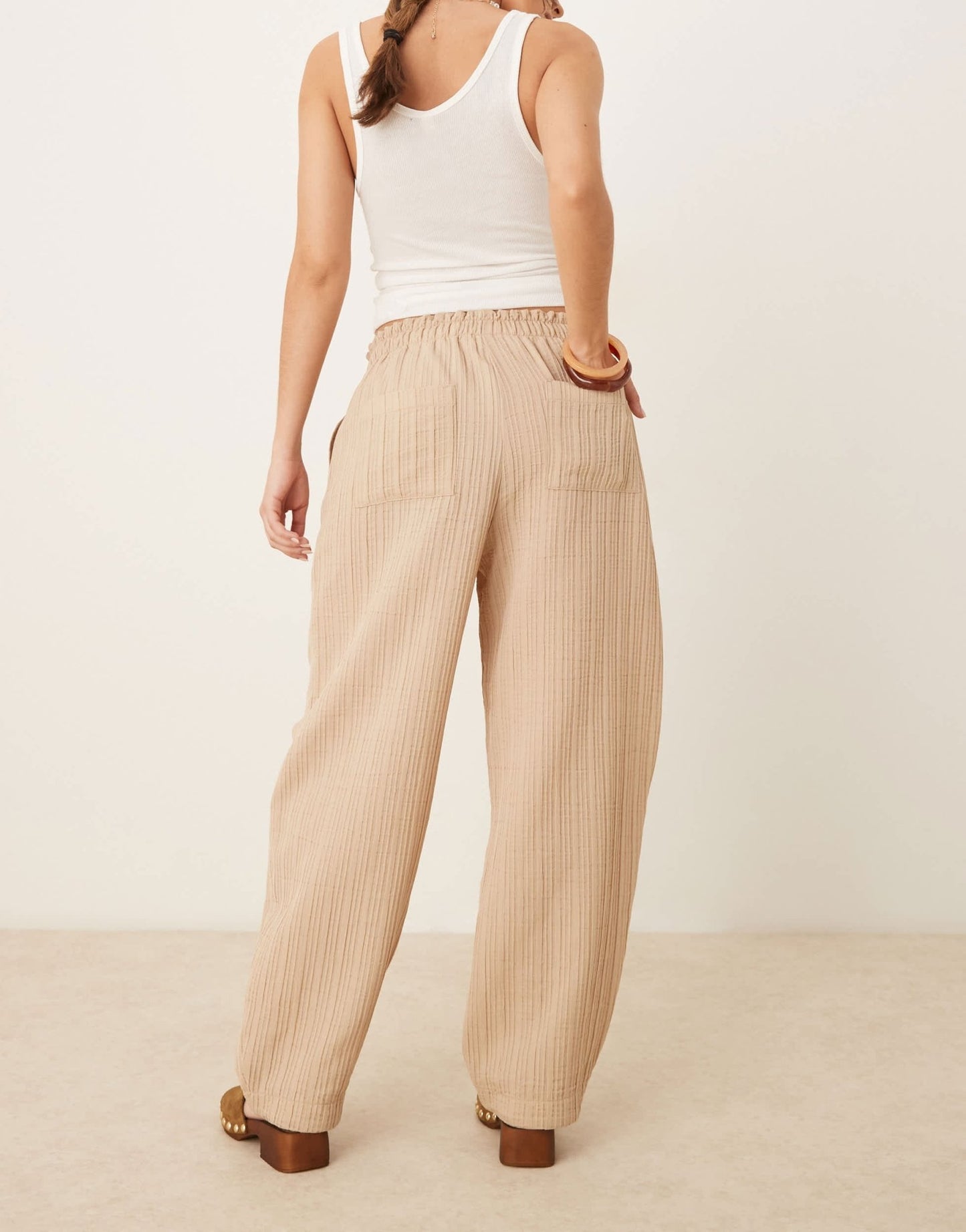 ASOS DESIGN tailored textured drawstring waist arch leg trousers in stone - ASOS Sample Sale