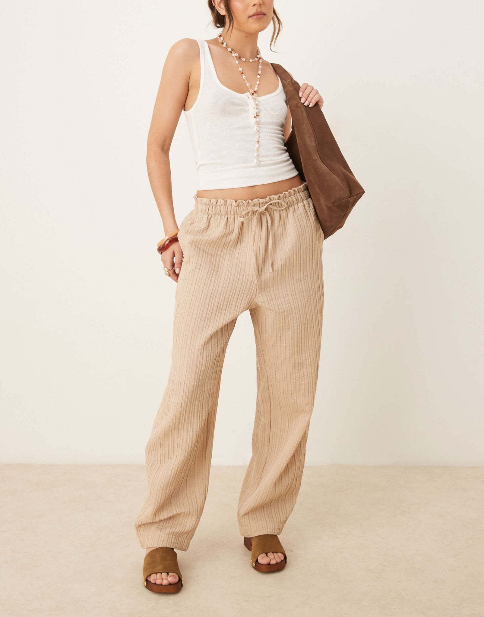 ASOS DESIGN tailored textured drawstring waist arch leg trousers in stone - ASOS Sample Sale
