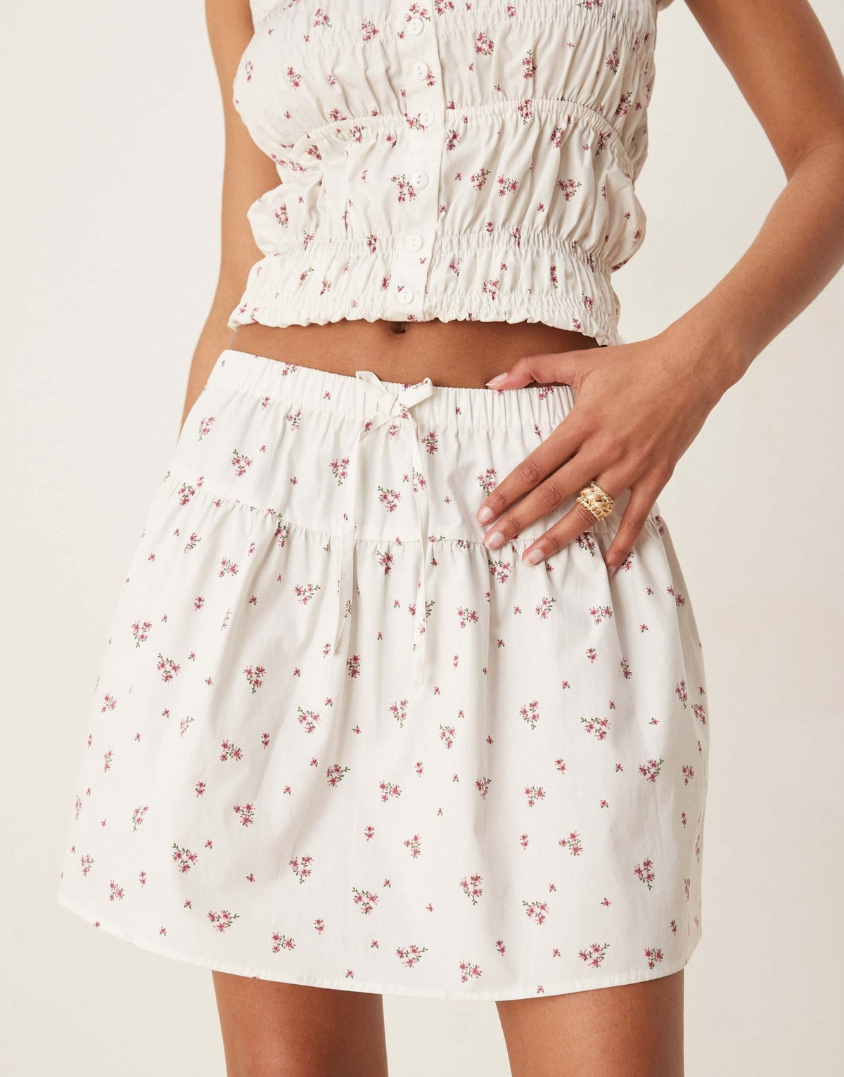 Esmee Exclusive tie front mini beach skirt with trim detail in white and pink ditsy print - ASOS Sample Sale