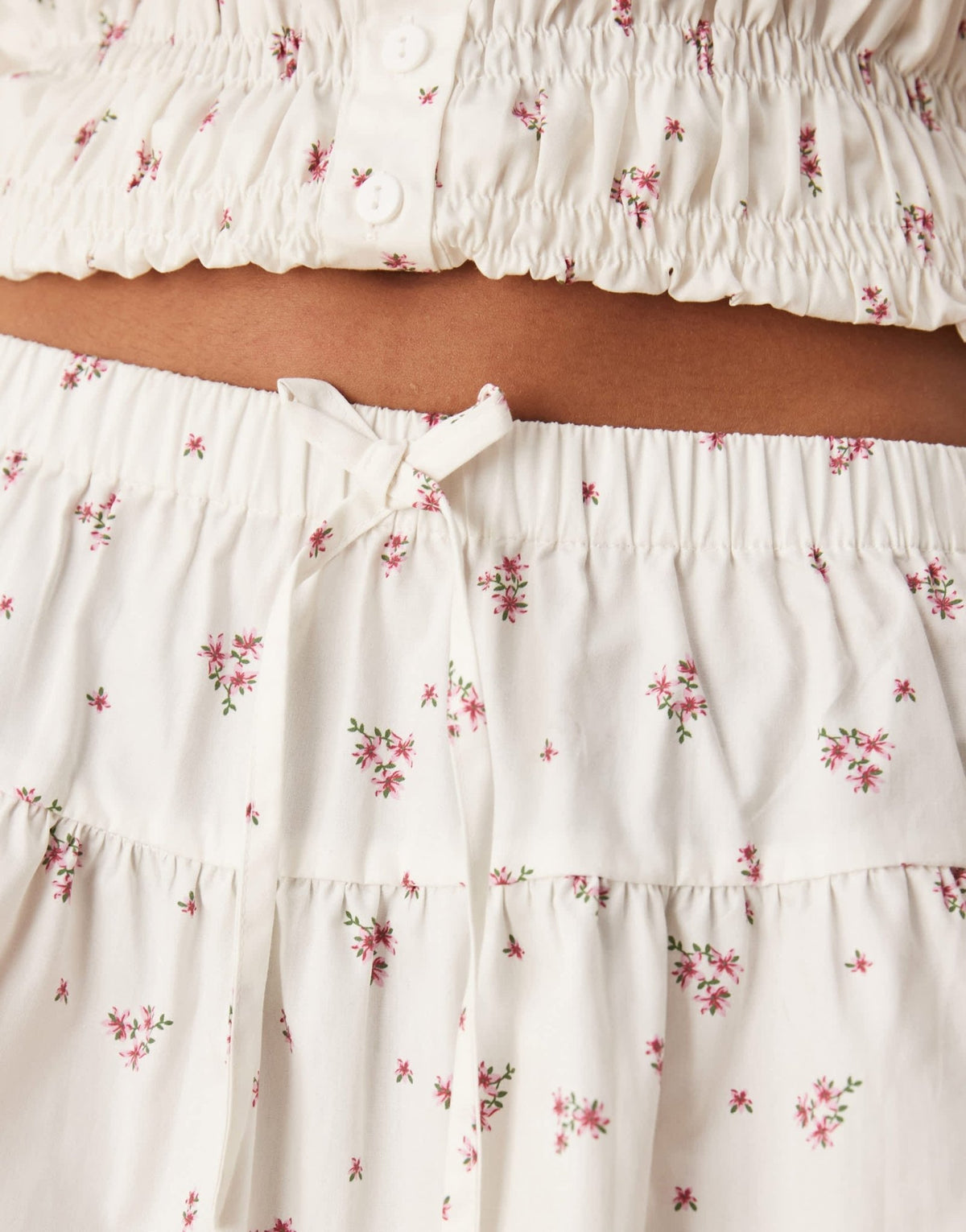 Esmee Exclusive tie front mini beach skirt with trim detail in white and pink ditsy print - ASOS Sample Sale