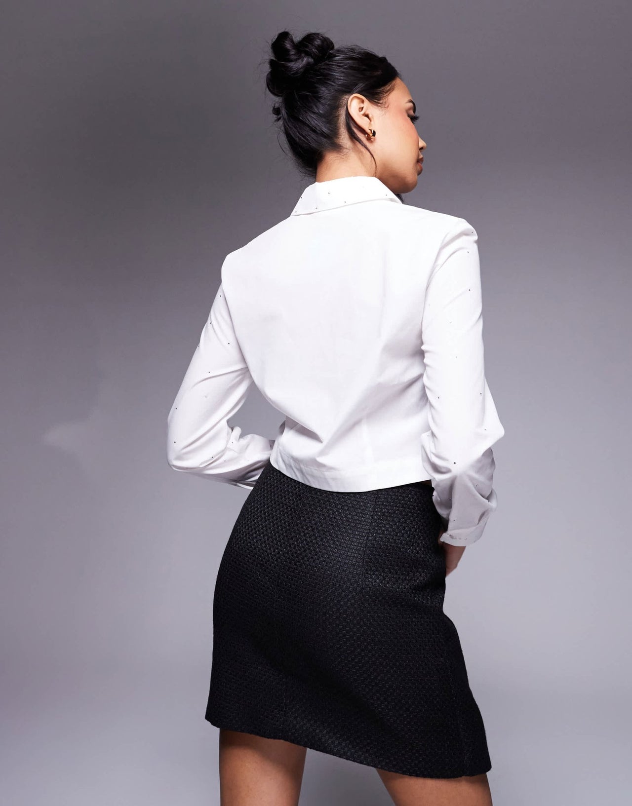 In The Style x Perrie Sian boucle diamante bow detail wrap mini skirt in black - ASOS Sample Sale