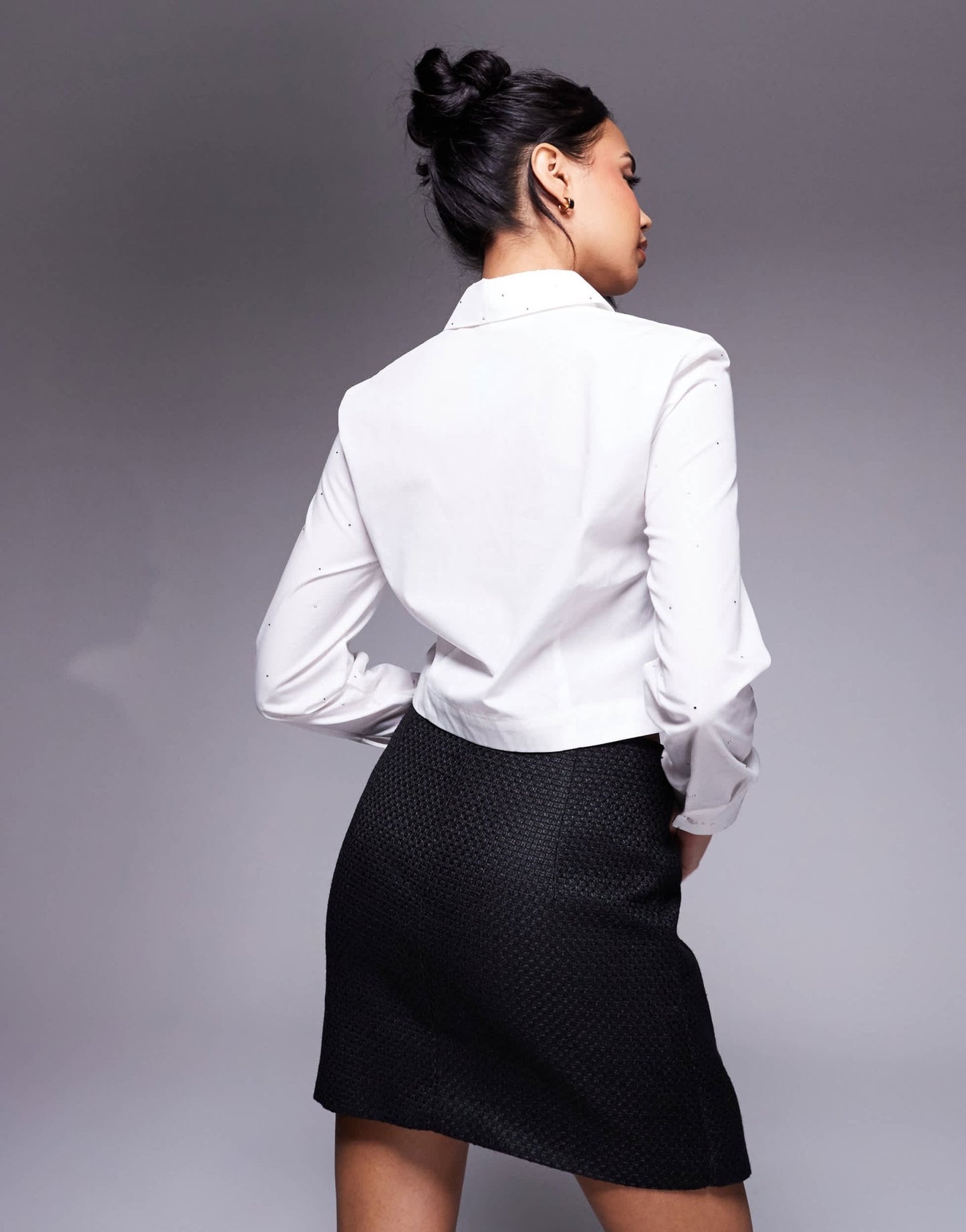 In The Style x Perrie Sian boucle diamante bow detail wrap mini skirt in black - ASOS Sample Sale