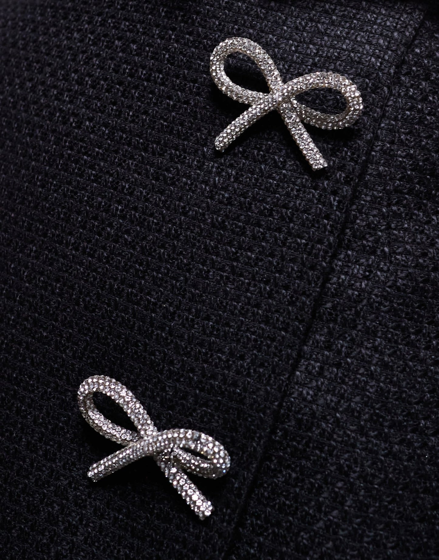 In The Style x Perrie Sian boucle diamante bow detail wrap mini skirt in black - ASOS Sample Sale