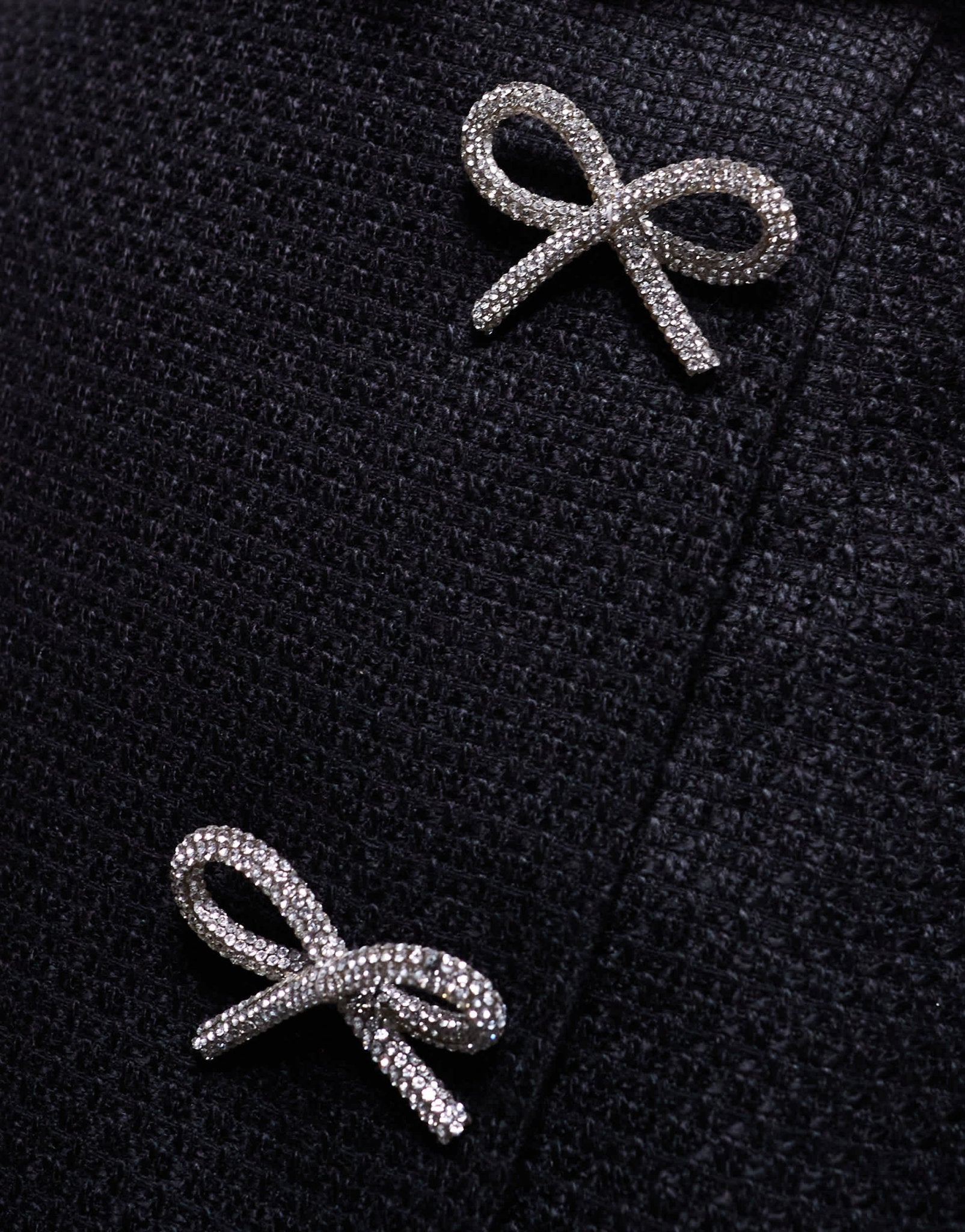 In The Style x Perrie Sian boucle diamante bow detail wrap mini skirt in black - ASOS Sample Sale