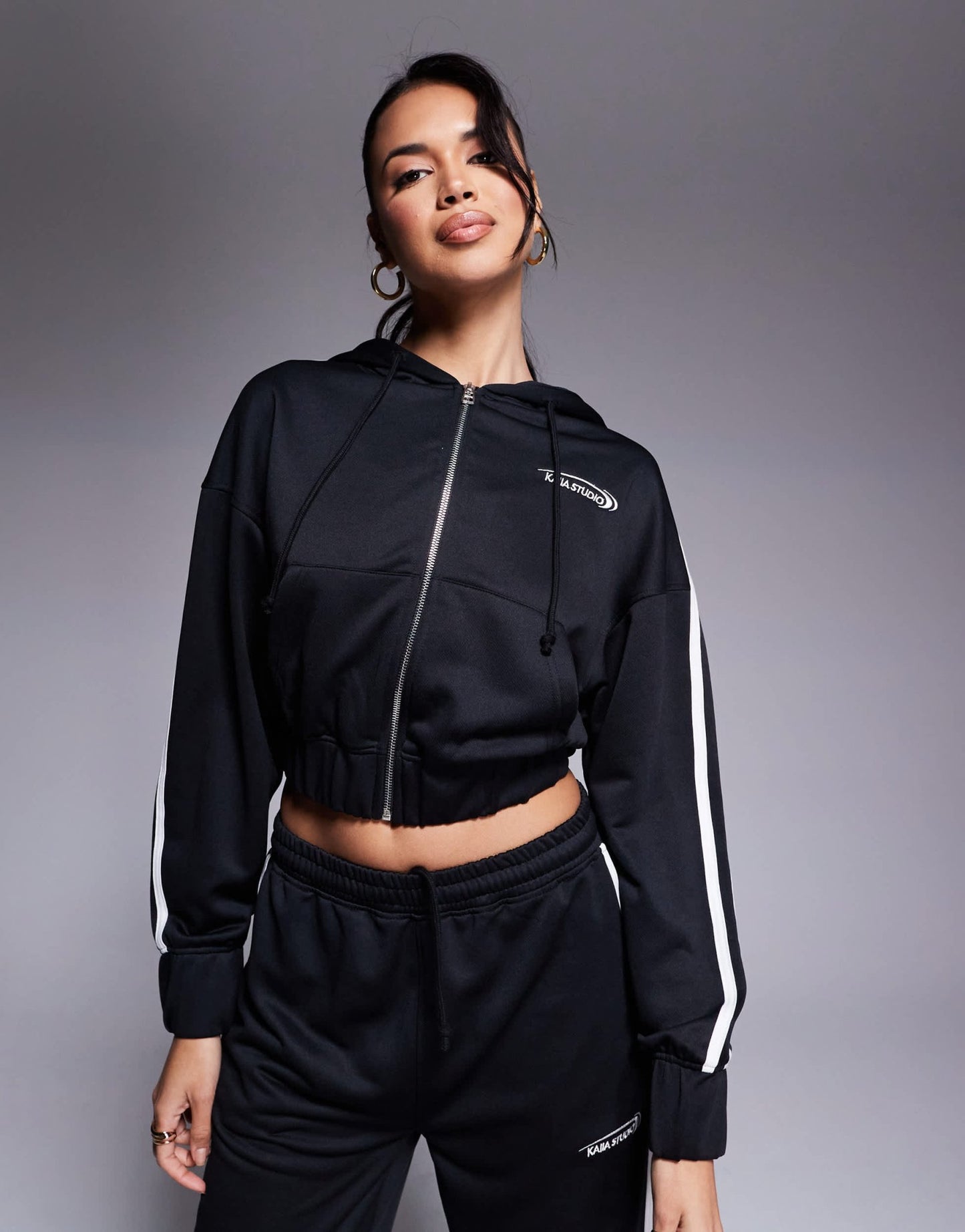 Kaiia cotton blend Studio cropped side stripe zip up hoodie co-ord in black - ASOS Sample Sale