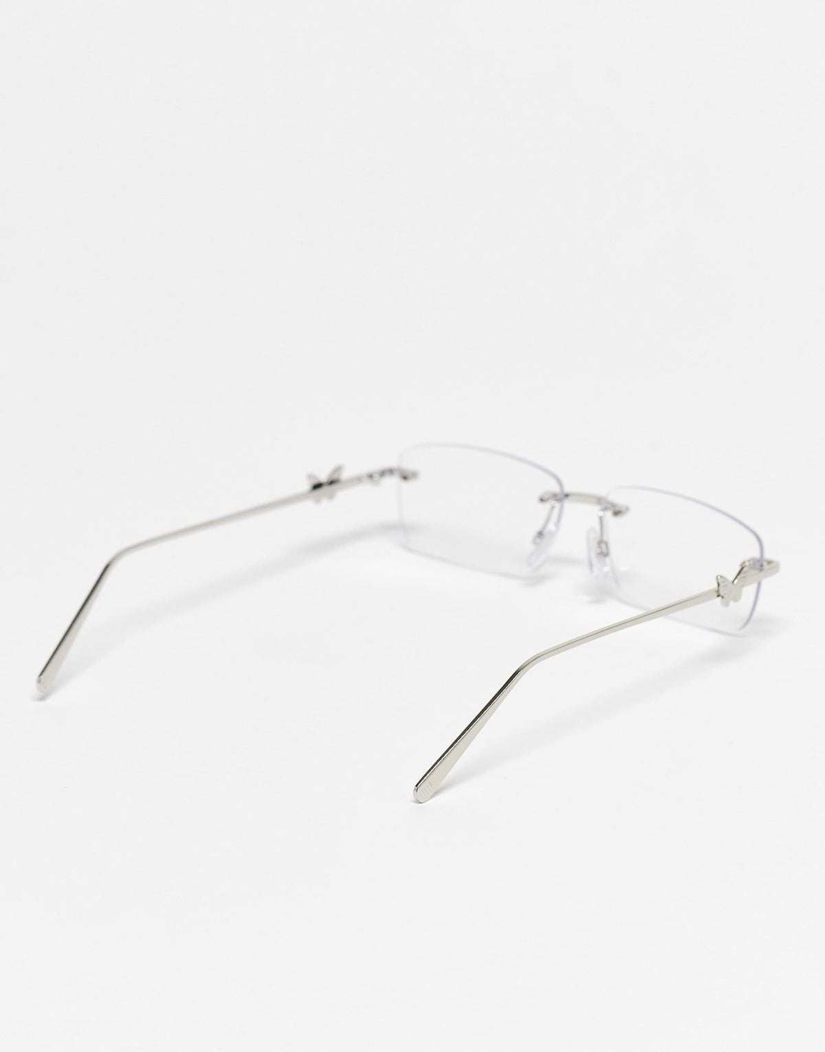Kaiia exclusive rectangular rimless blue light lens butterfly detail glasses in silver - ASOS Sample Sale