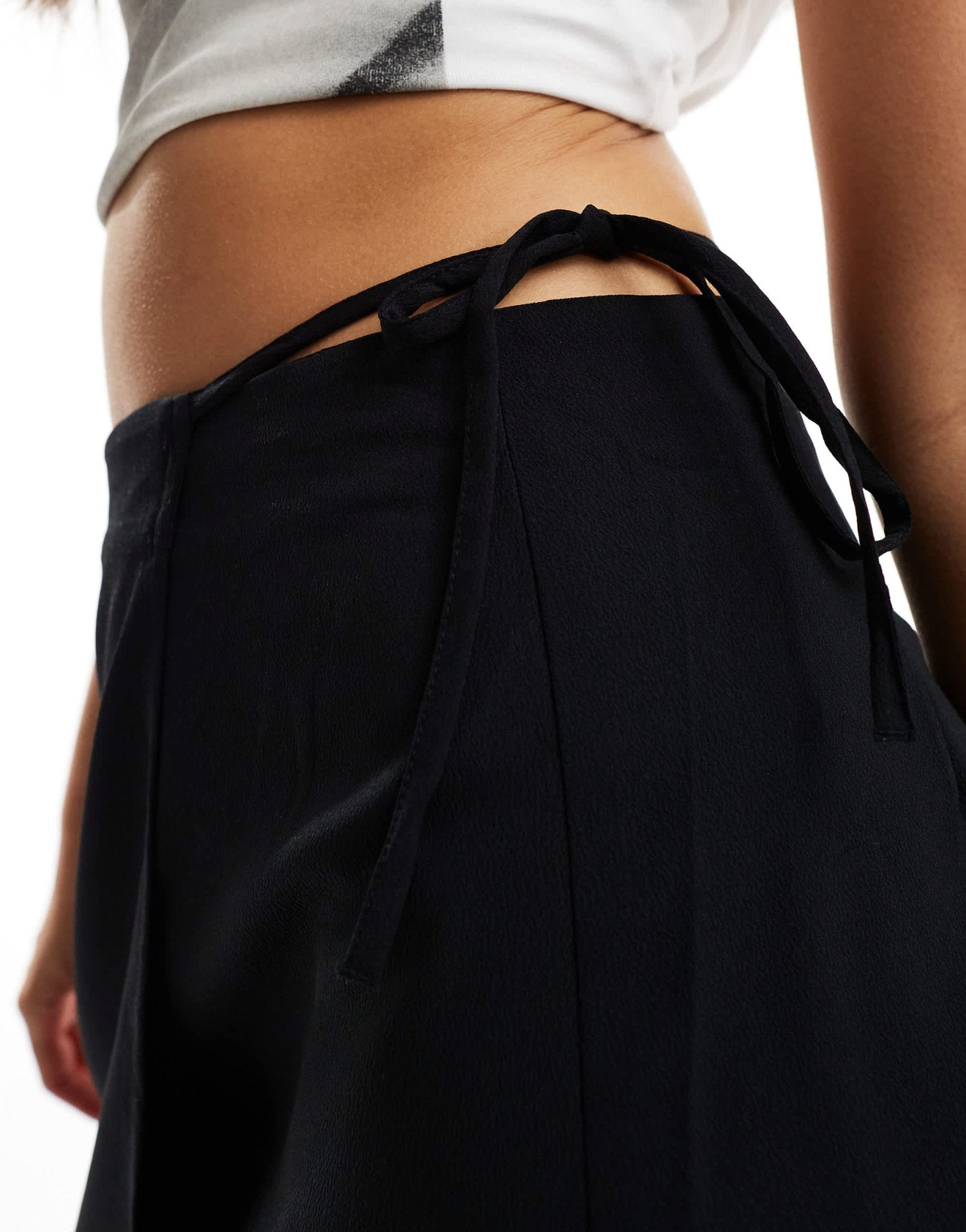 Monki mini wrap skirt with tie up side in black - ASOS Sample Sale