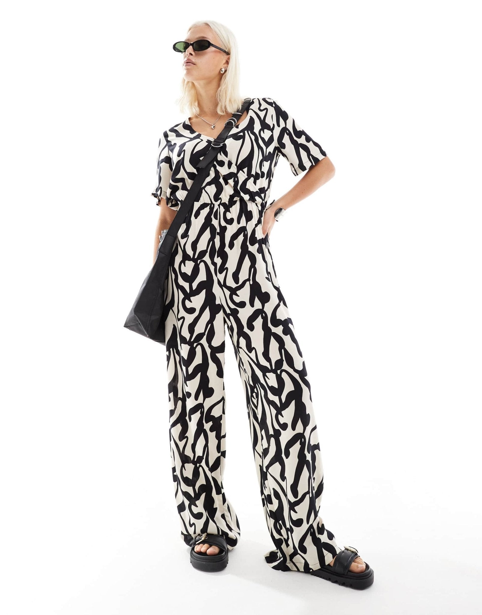 Monki short sleeve jumpsuit with wrap front in bold mono abstract print - ASOS Sample Sale