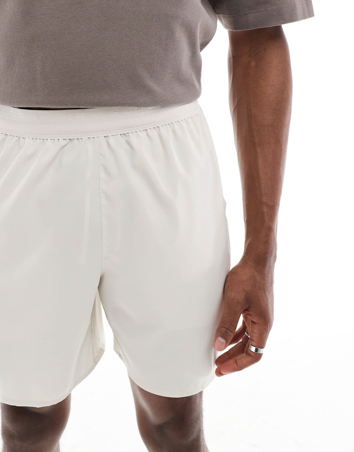 Nike Air Run shorts in beige - ASOS Sample Sale