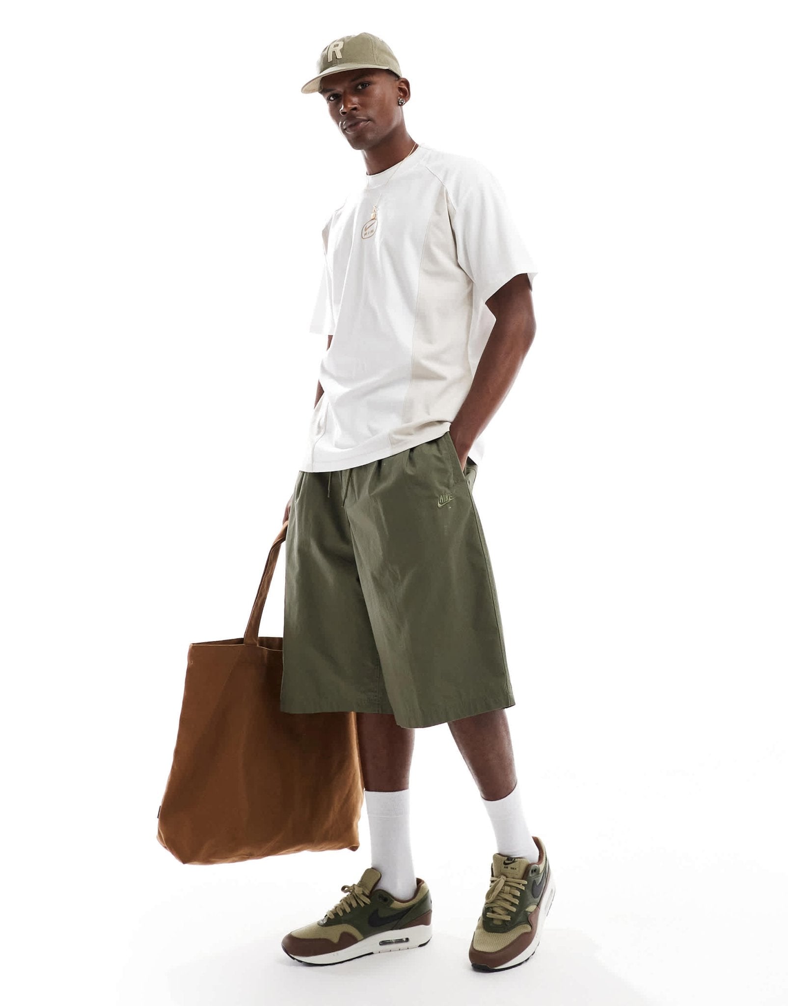 Nike Club Woven oversized short in green - ASOS Sample Sale