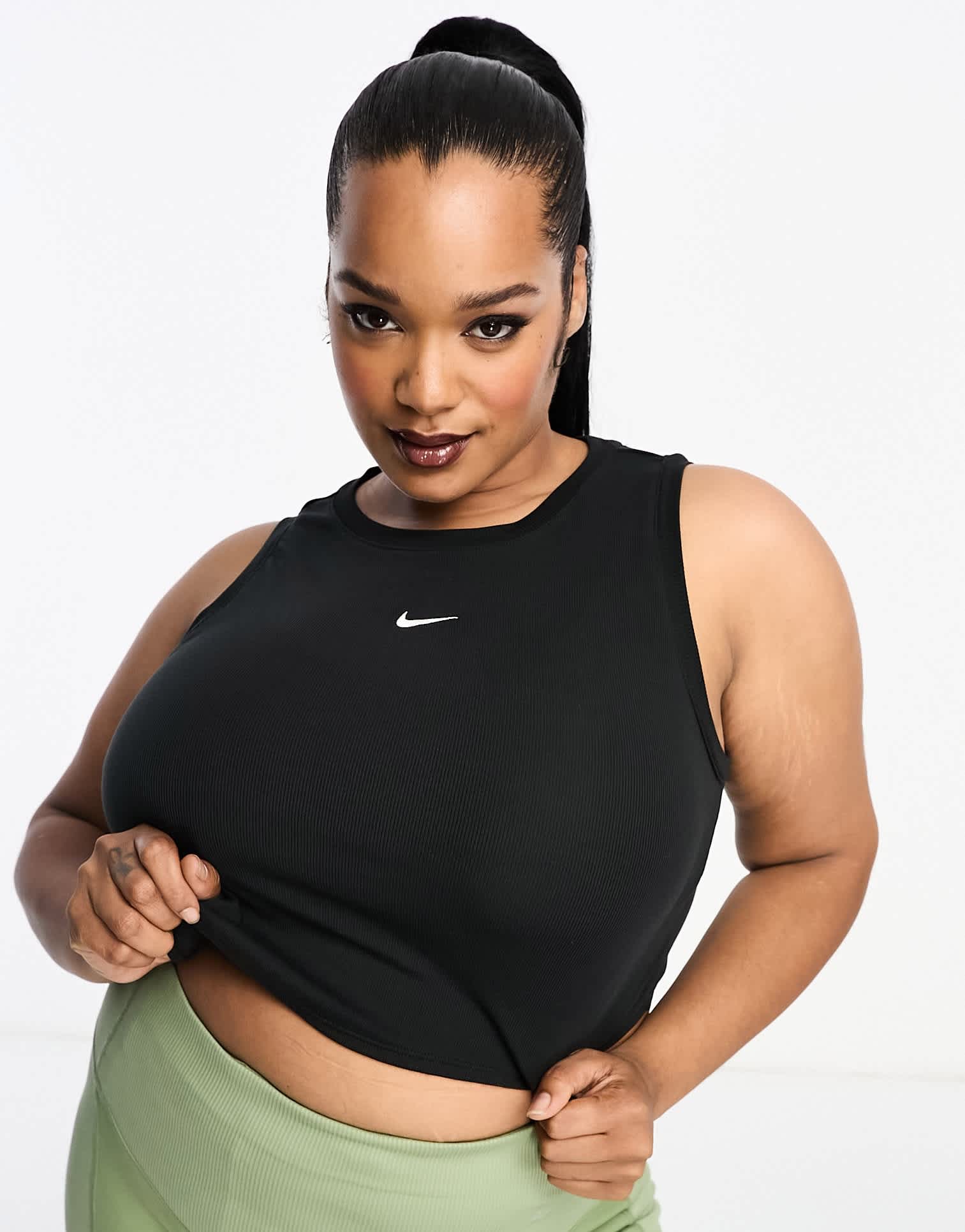 Nike Plus mini swoosh curve hem tank vest top in black - ASOS Sample Sale