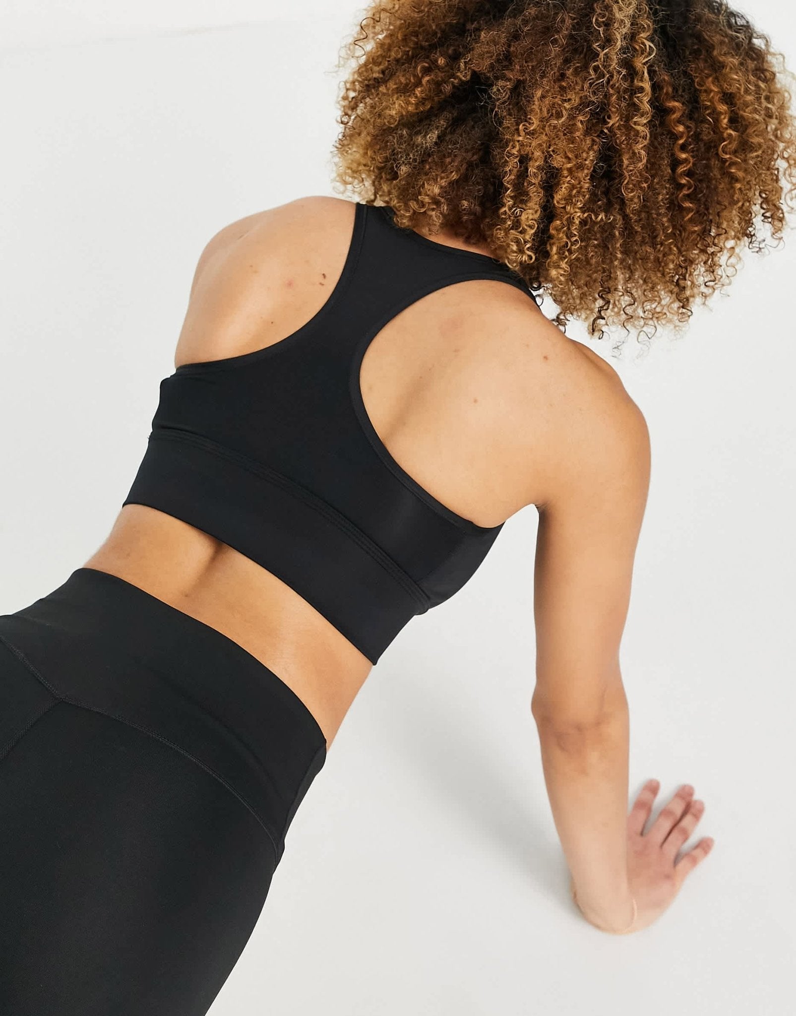 Nike Training Dri - FIT Swoosh longline medium - support padded bra in black - ASOS Sample Sale