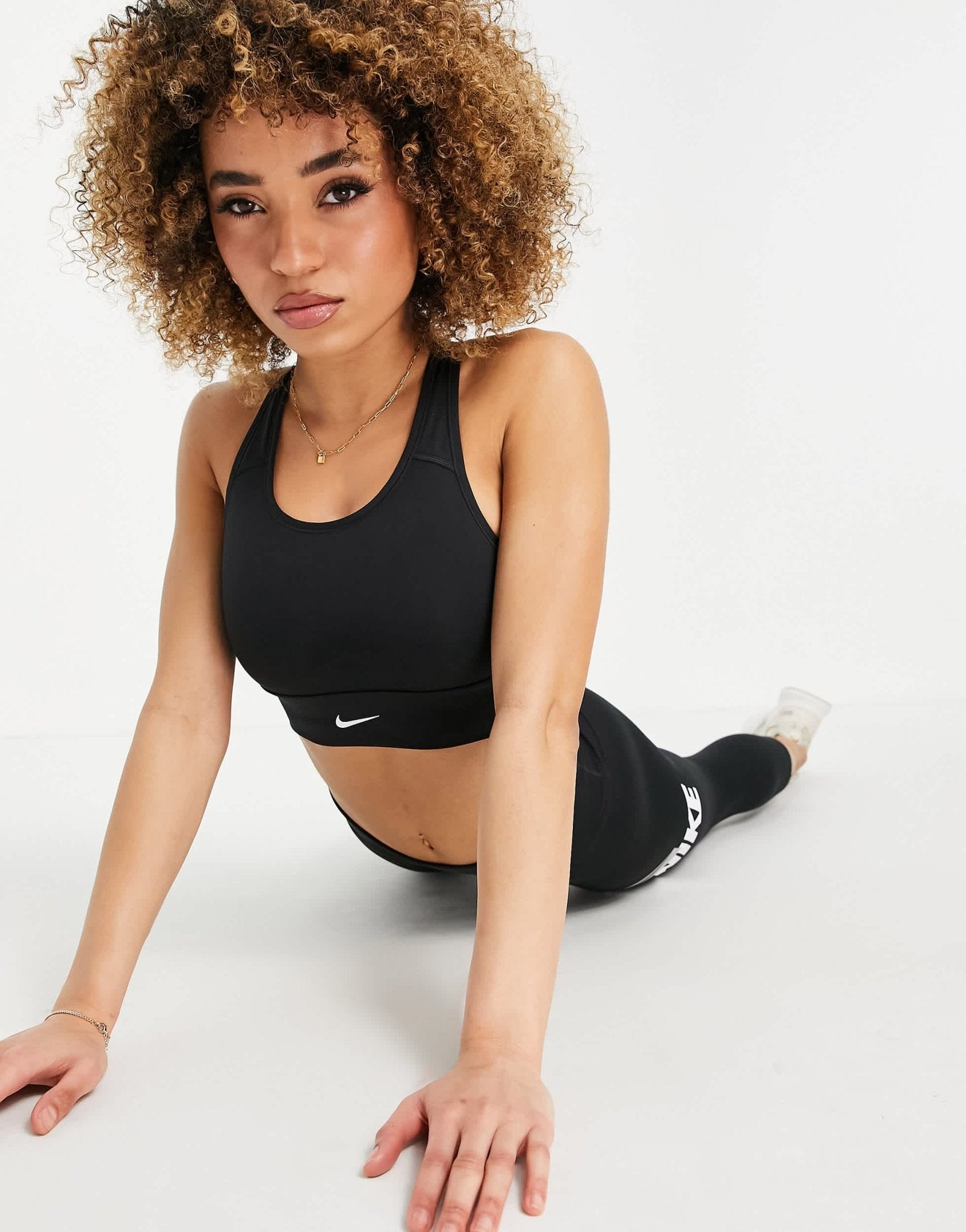 Nike Training Dri - FIT Swoosh longline medium - support padded bra in black - ASOS Sample Sale