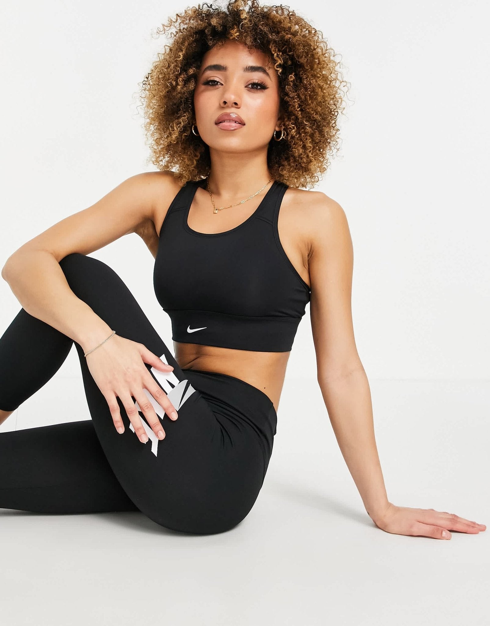 Nike Training Dri - FIT Swoosh longline medium - support padded bra in black - ASOS Sample Sale