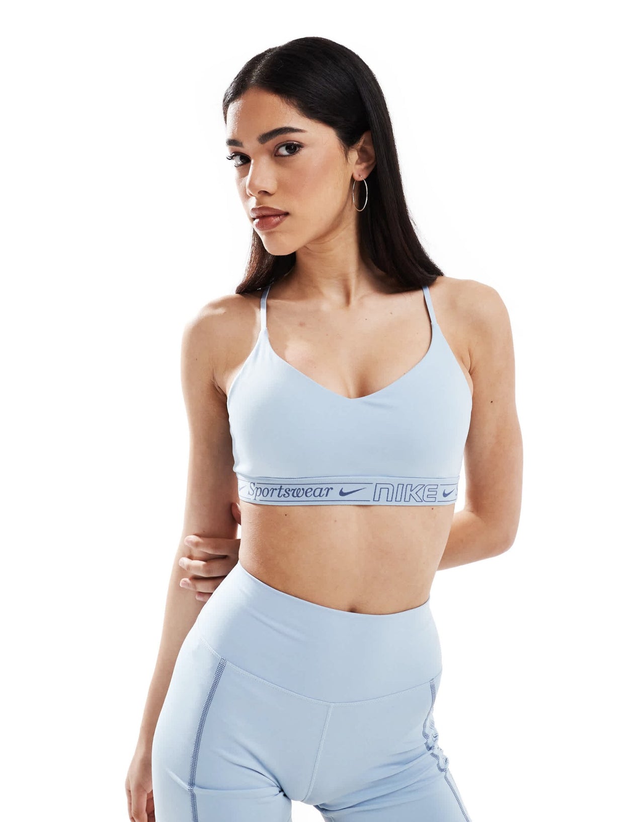 Nike Training Gym Life Swoosh Indy Dri - FIT light support sports bra in light blue - ASOS Sample Sale