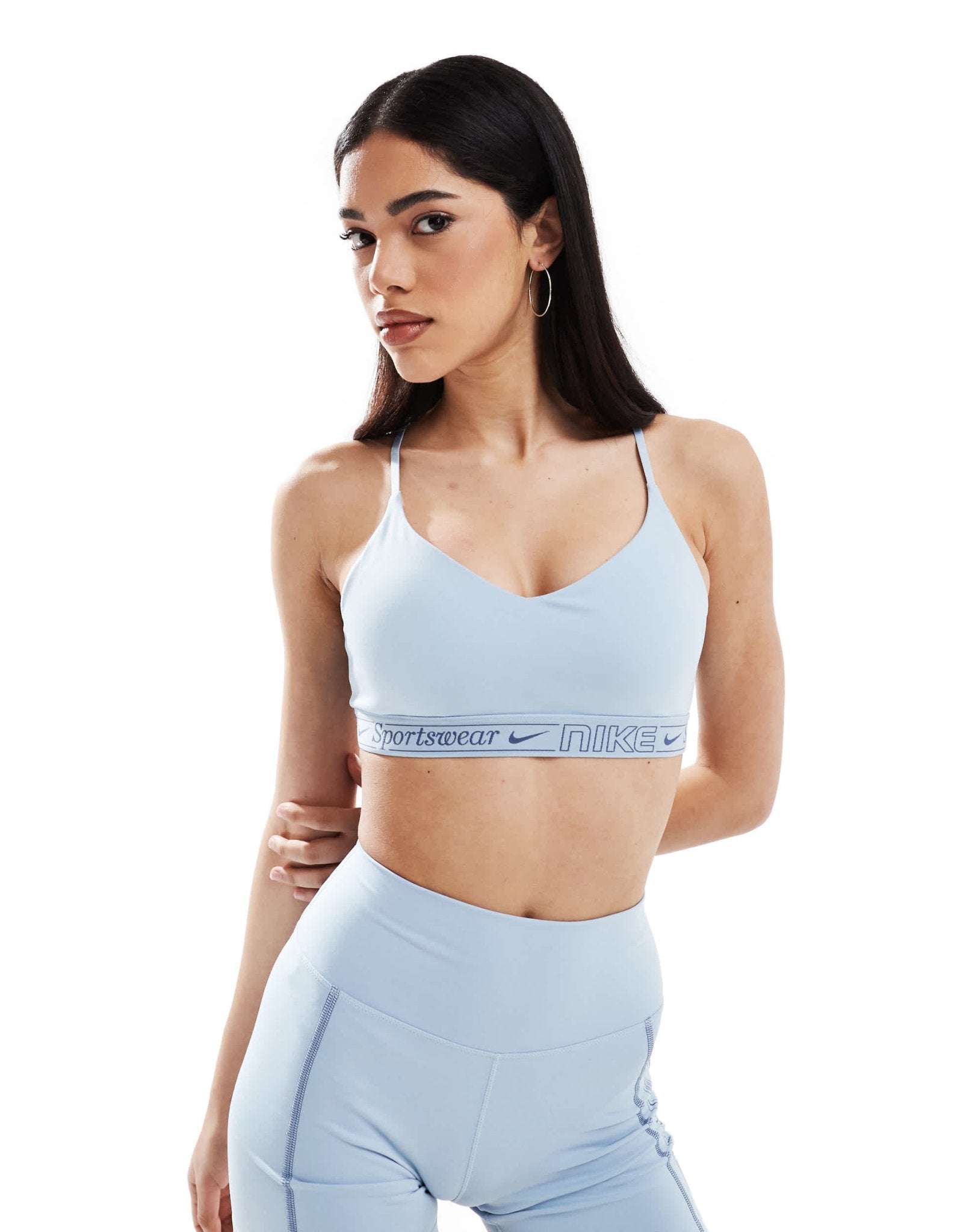 Nike Training Gym Life Swoosh Indy Dri - FIT light support sports bra in light blue - ASOS Sample Sale