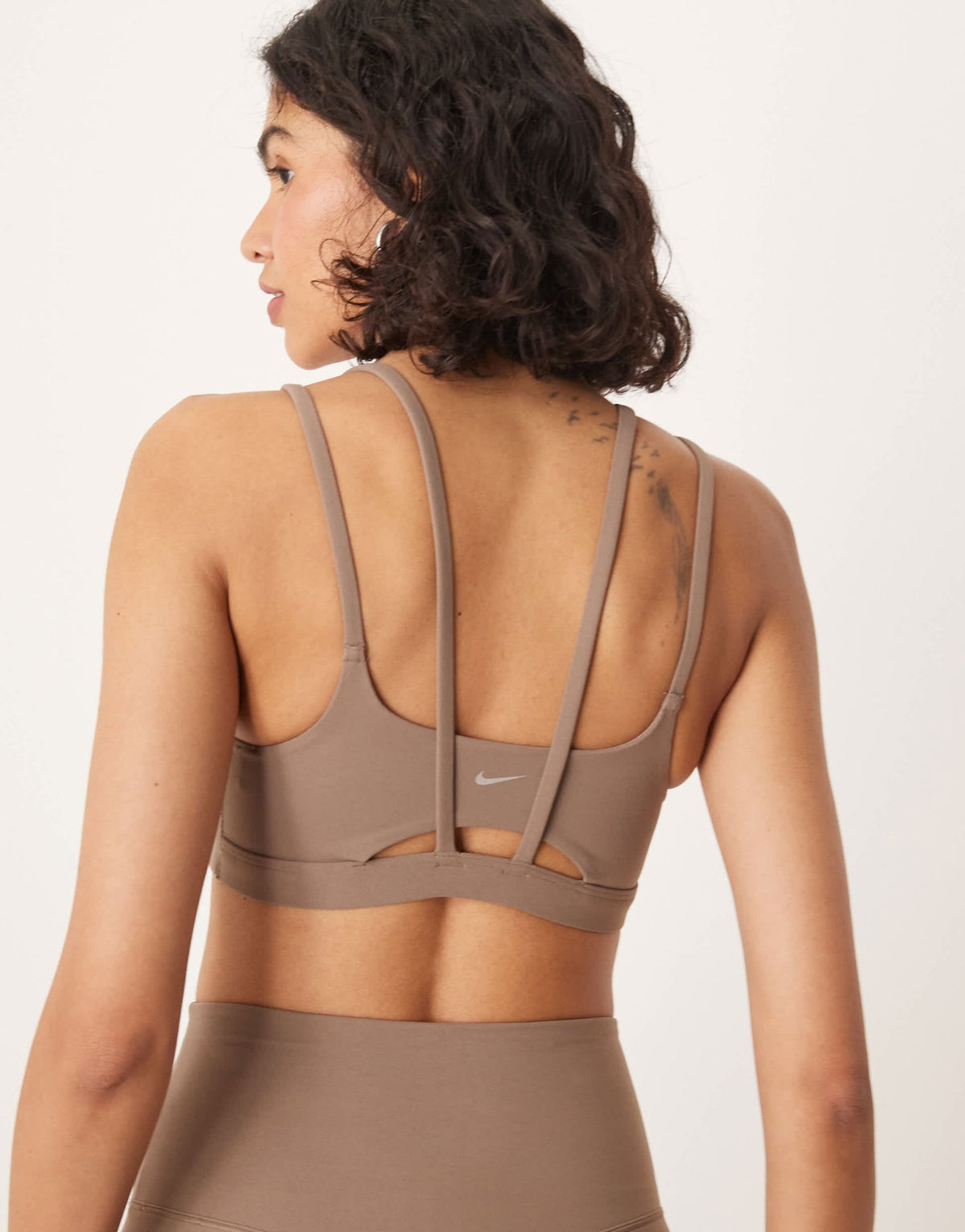 Nike Training Zenvy Dri-FIT soft touch Alate light support sports bra in brown - ASOS Sample Sale