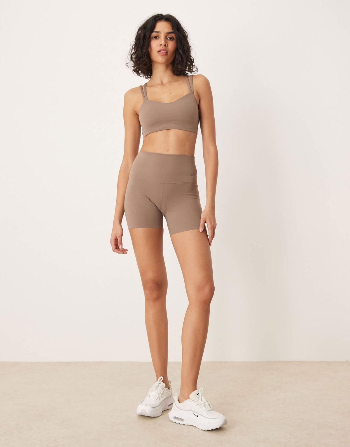 Nike Training Zenvy Dri-FIT soft touch Alate light support sports bra in brown - ASOS Sample Sale