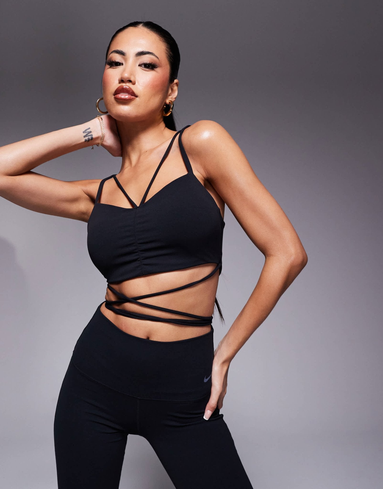 Nike Zenvy Training strappy light support sports bra in black - ASOS Sample Sale