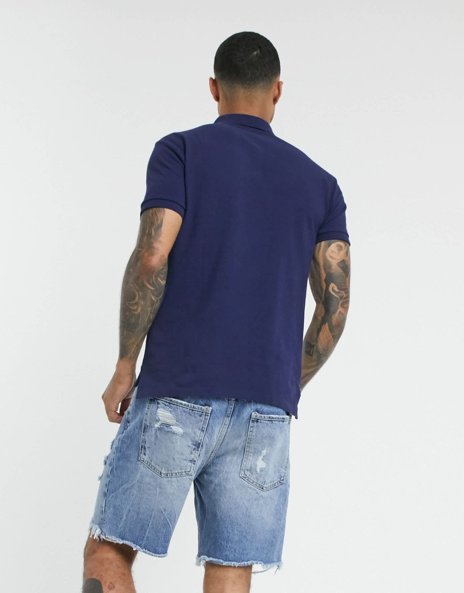 Polo Ralph Lauren slim fit pique polo with red player logo in washed navy - ASOS Sample Sale