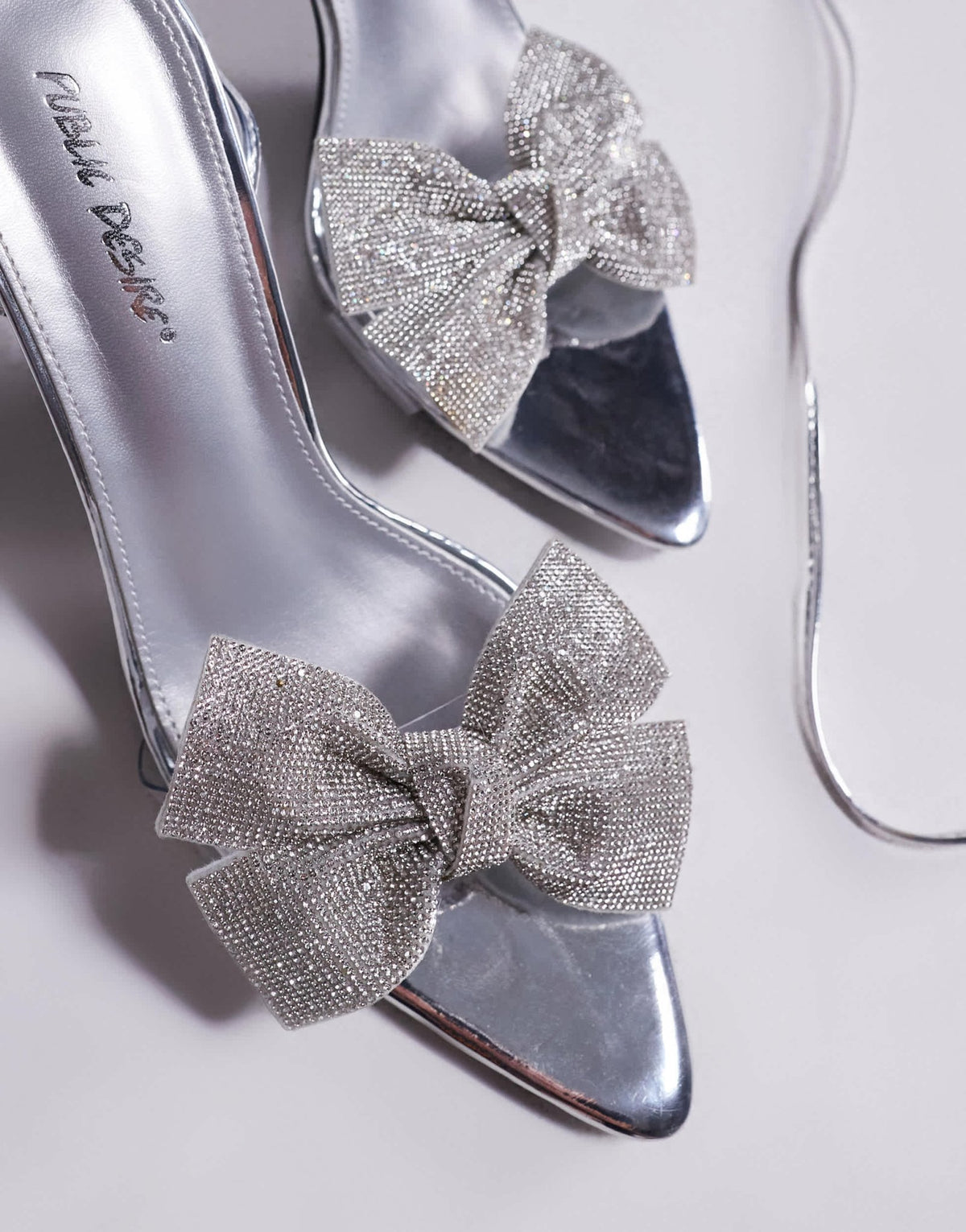 Public Desire Fame embellished bowmid heel sandals in silver mirror - ASOS Sample Sale