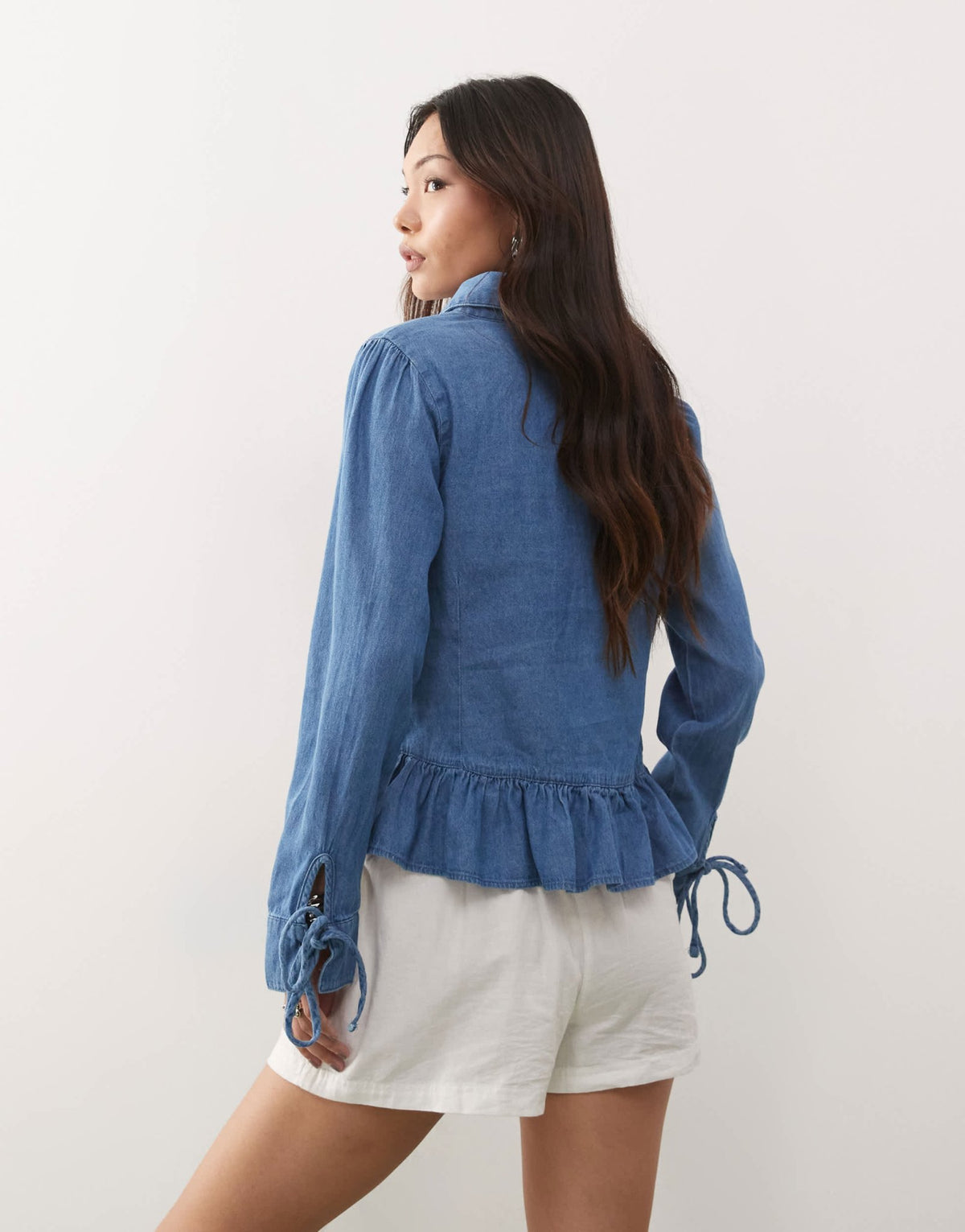 Reclaimed Vintage long sleeve denim tie front top with peplum hem in mid blue - ASOS Sample Sale