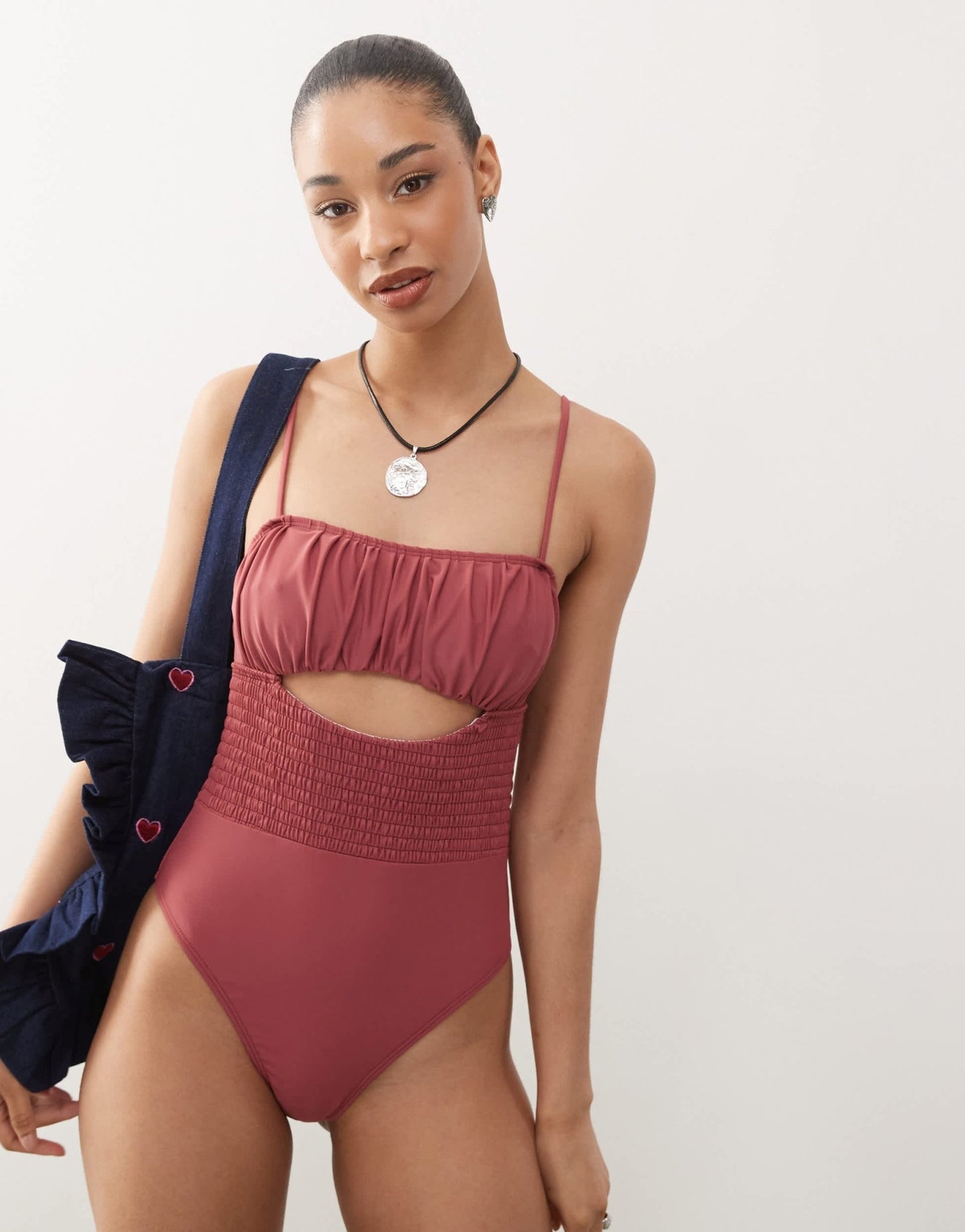 Reclaimed Vintage swimsuit with shirred waist and cut out detail in pink - ASOS Sample Sale